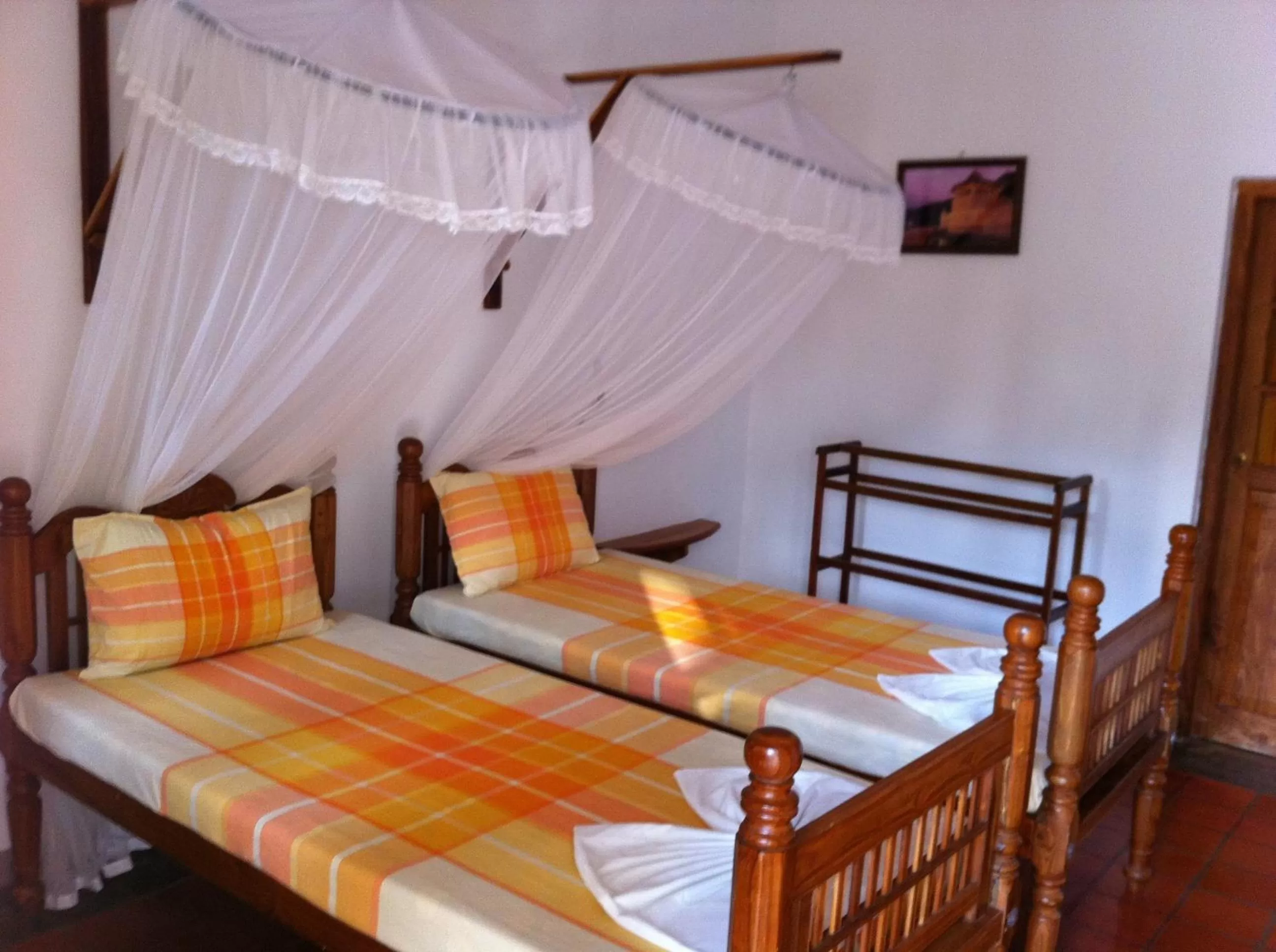 Bed in Little Paradise Tourist Guest House and Holiday Home