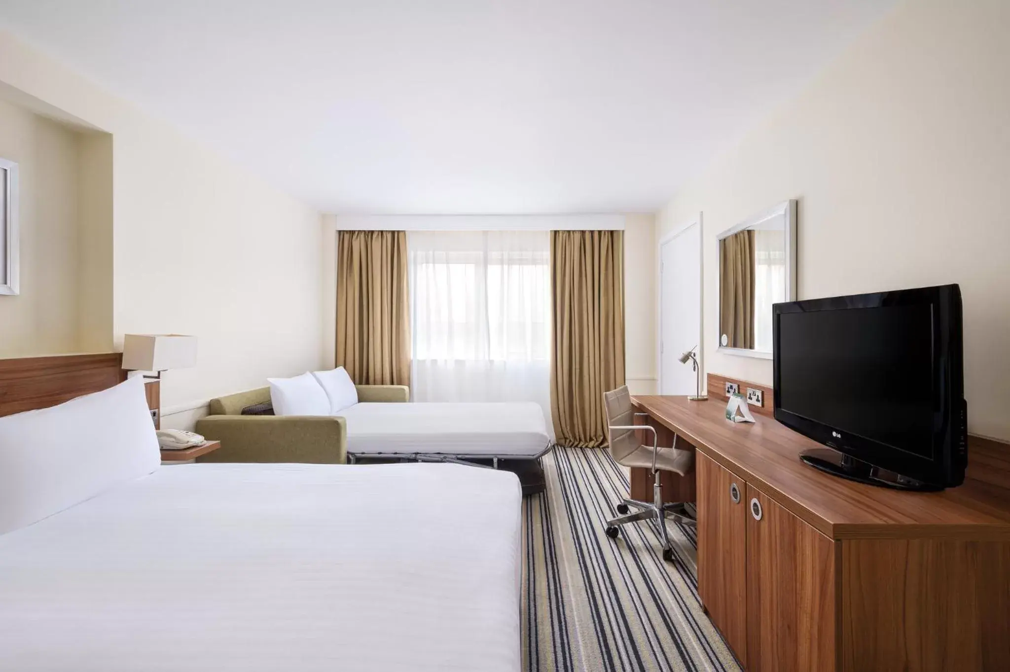 Photo of the whole room, TV/Entertainment Center in Holiday Inn Rochester-Chatham, an IHG Hotel