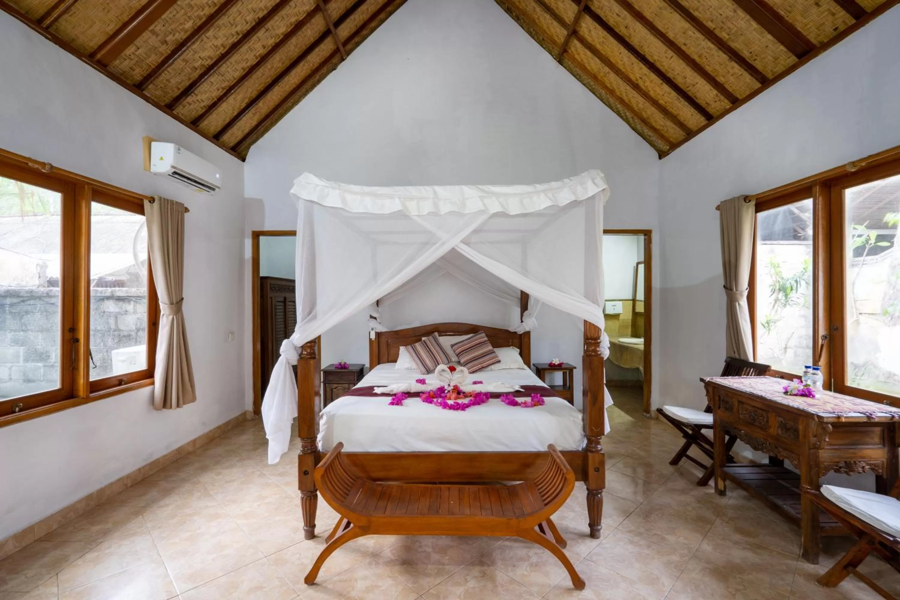 Bed in Mushroom Beach Bungalows