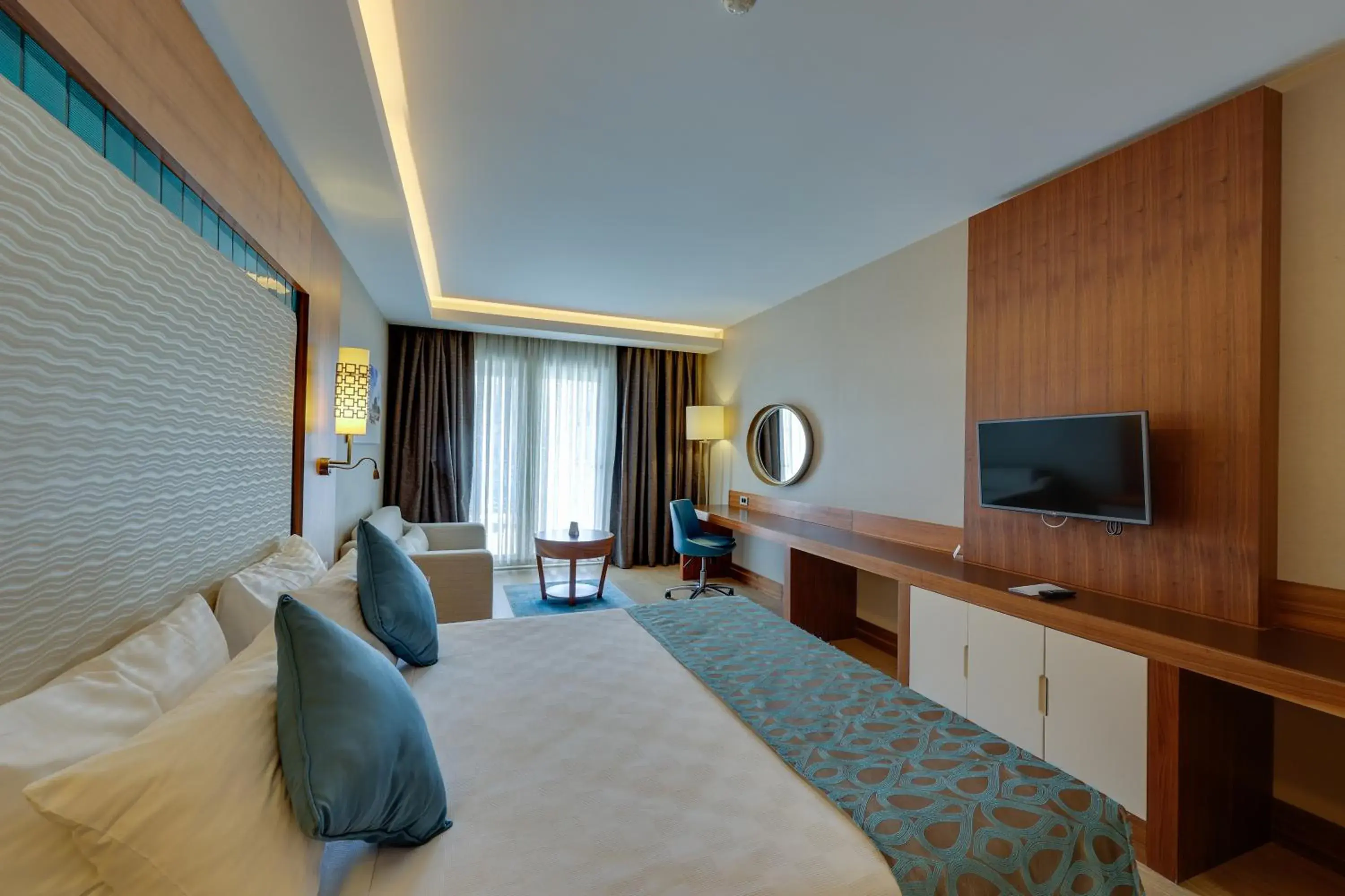 Photo of the whole room, TV/Entertainment Center in Ramada Hotel & Suites by Wyndham Kusadasi