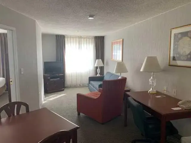 Living room, Seating Area in Host Inn an All Suites Hotel