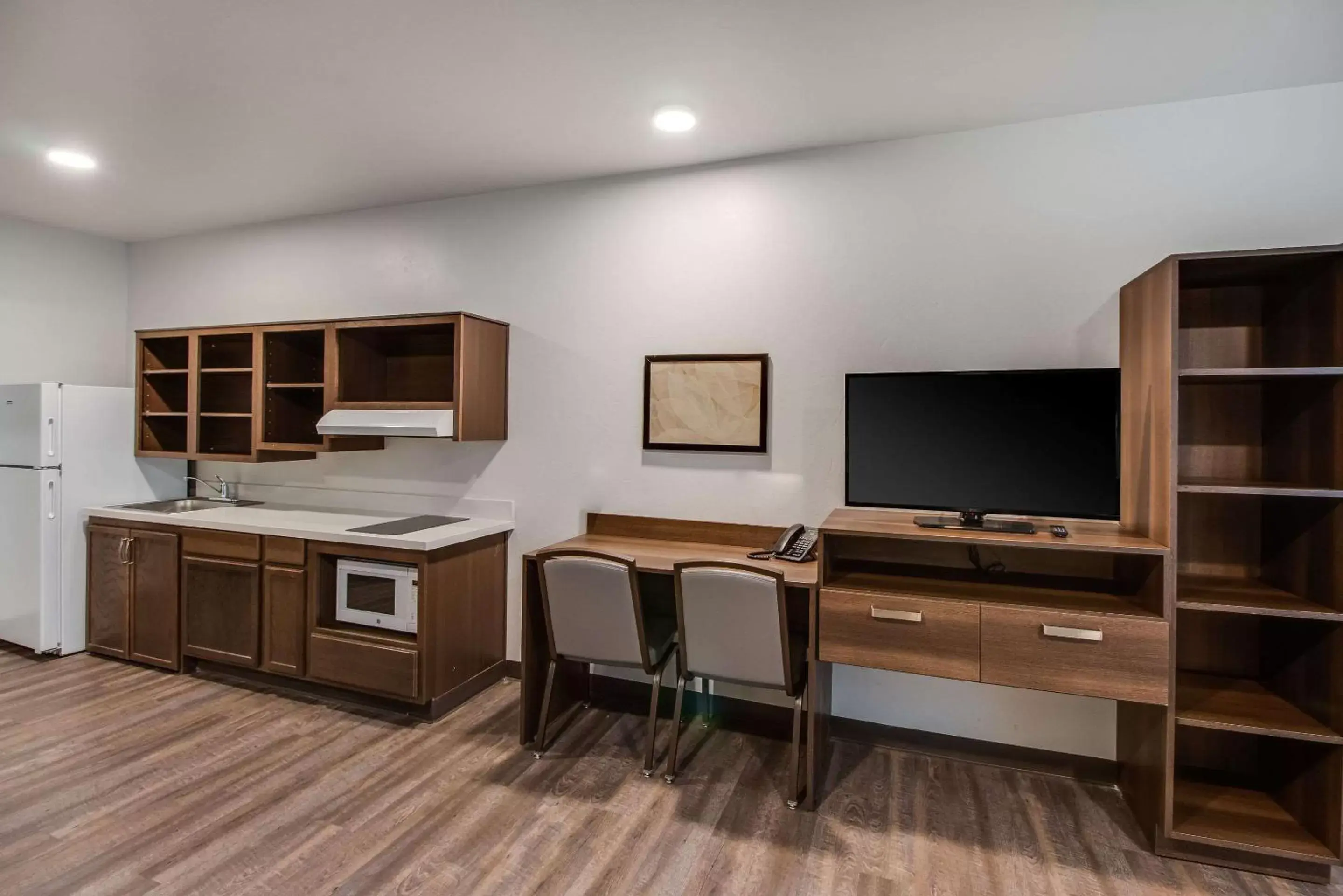 Photo of the whole room, TV/Entertainment Center in WoodSpring Suites Bakersfield Airport