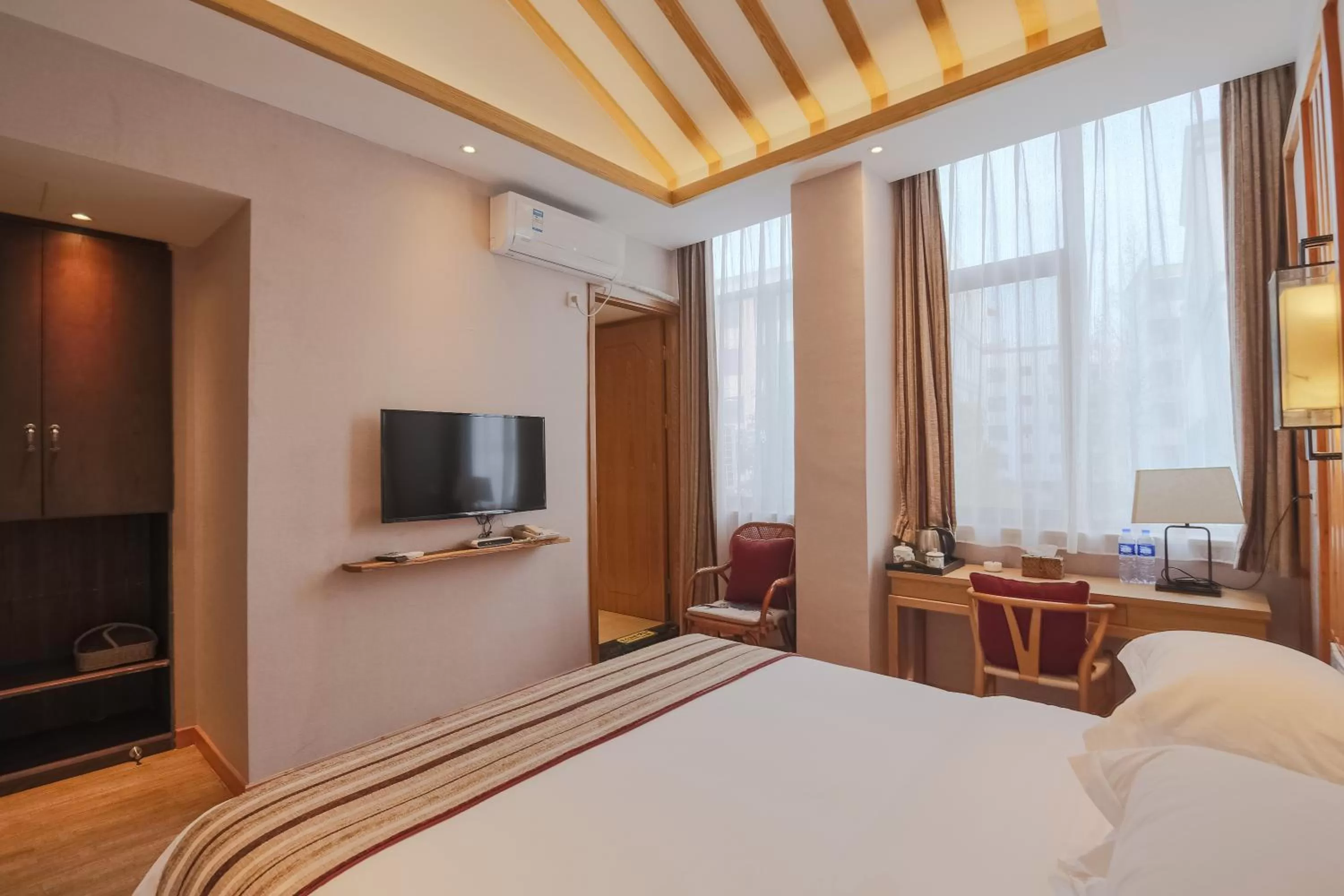 Photo of the whole room, TV/Entertainment Center in Mild Spring Boutique Hotel