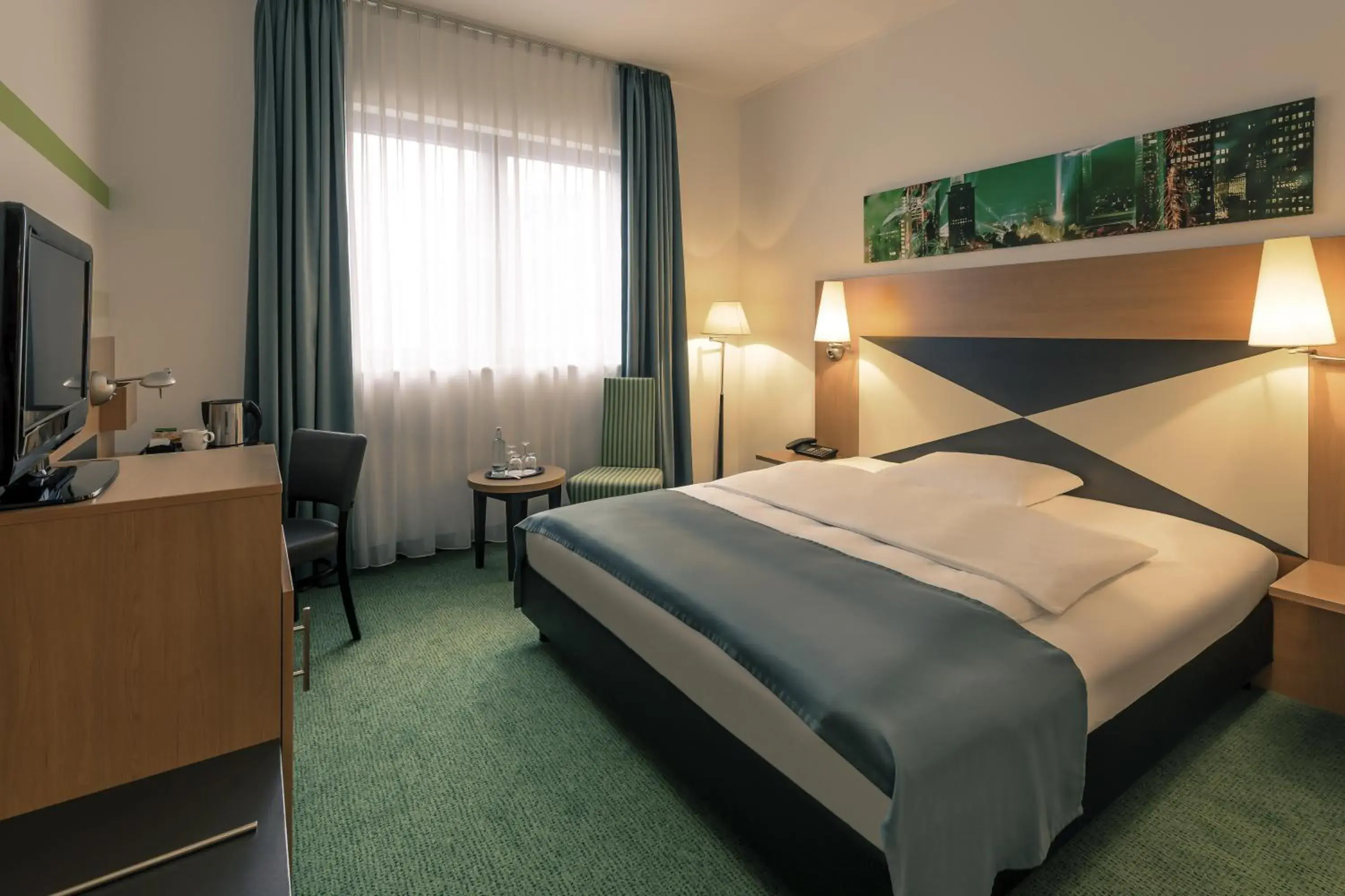 Photo of the whole room, Bed in Mercure Hotel Frankfurt Eschborn Süd