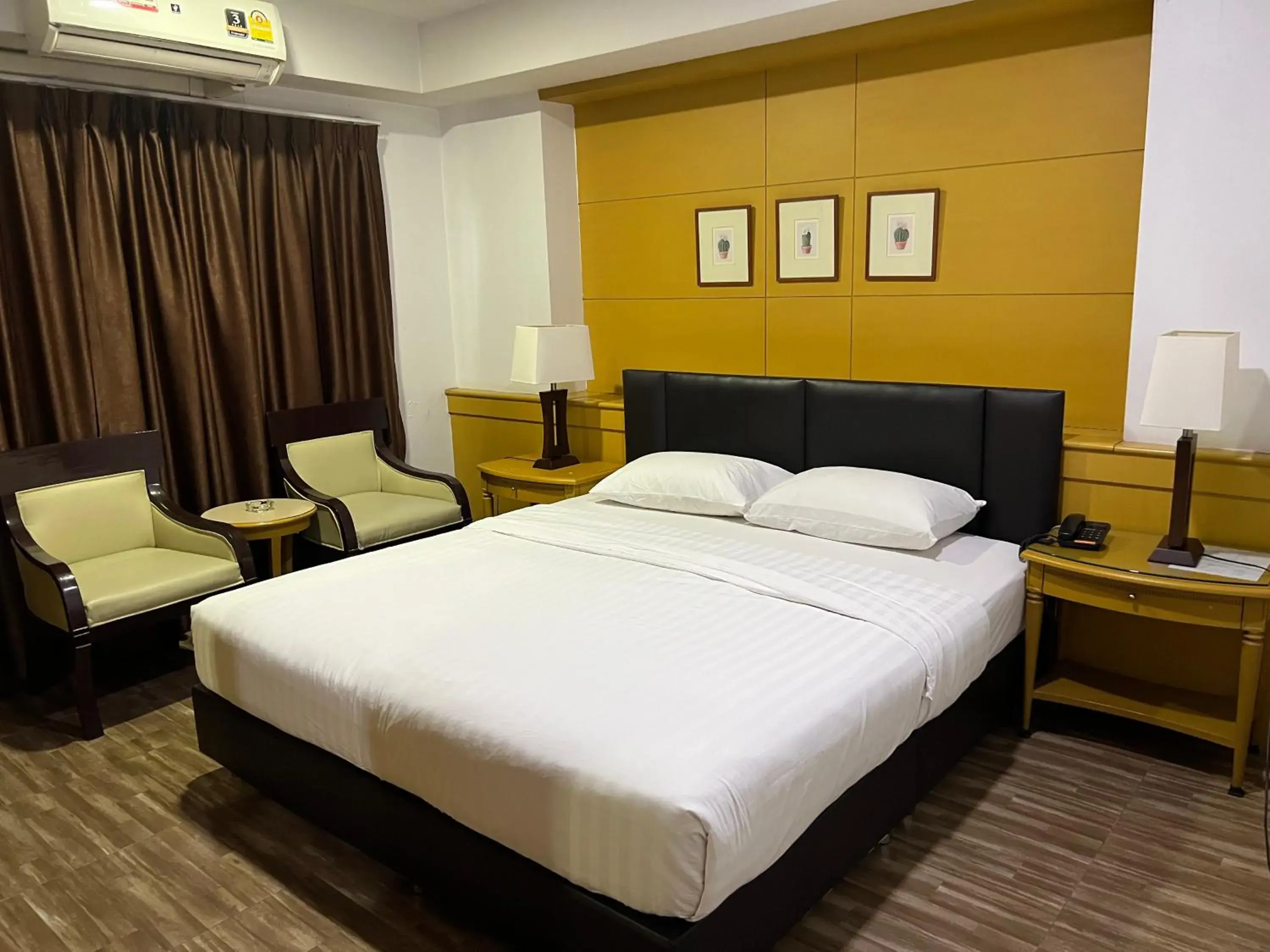 Bed in Mall Suites Hotel