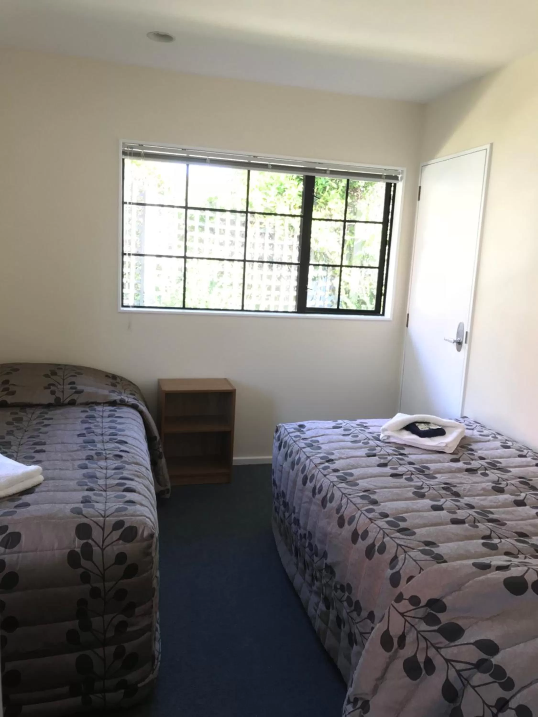 Bed in Tudor Lodge Motel