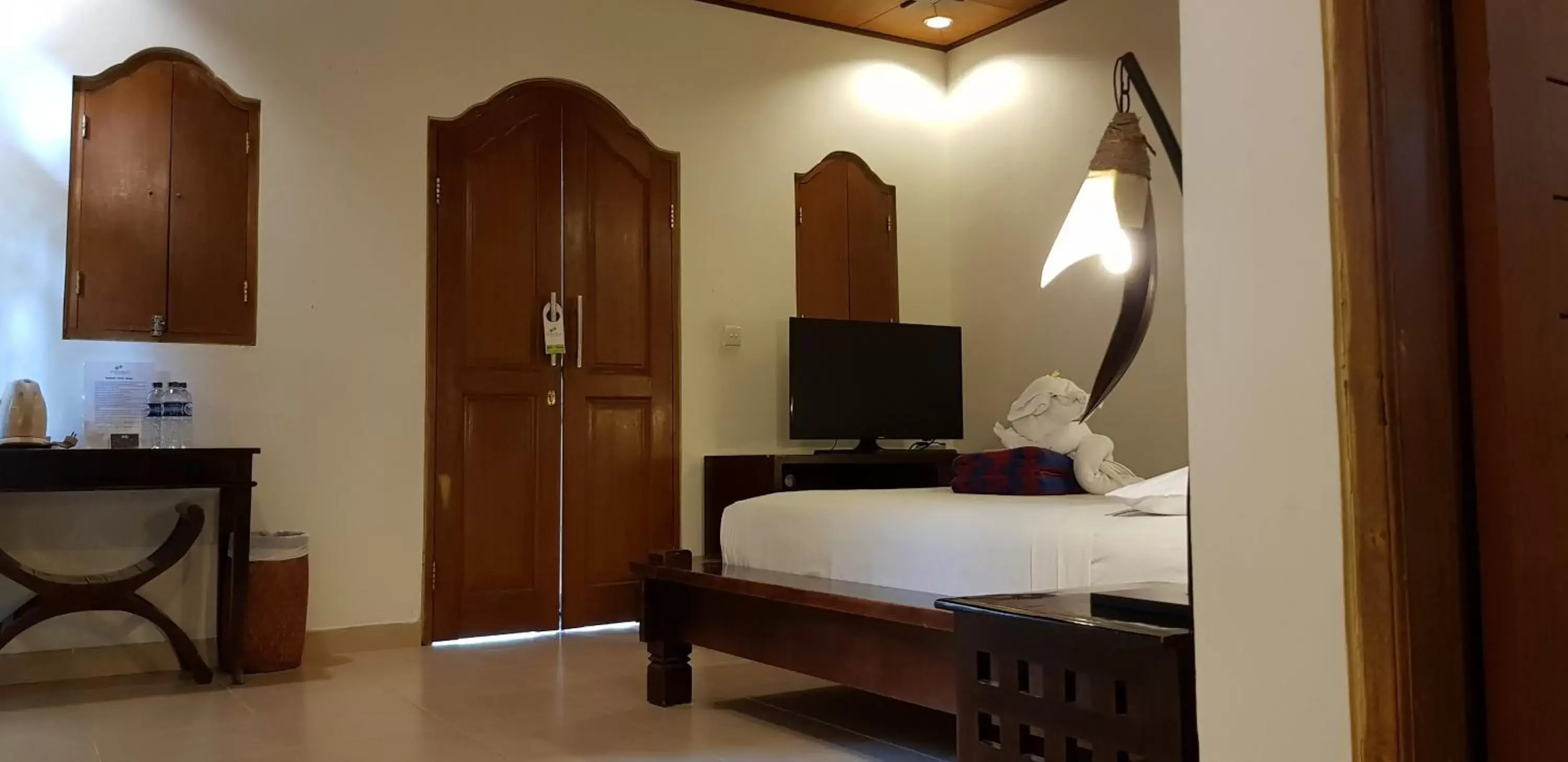 Bedroom, TV/Entertainment Center in Kusnadi Hotel