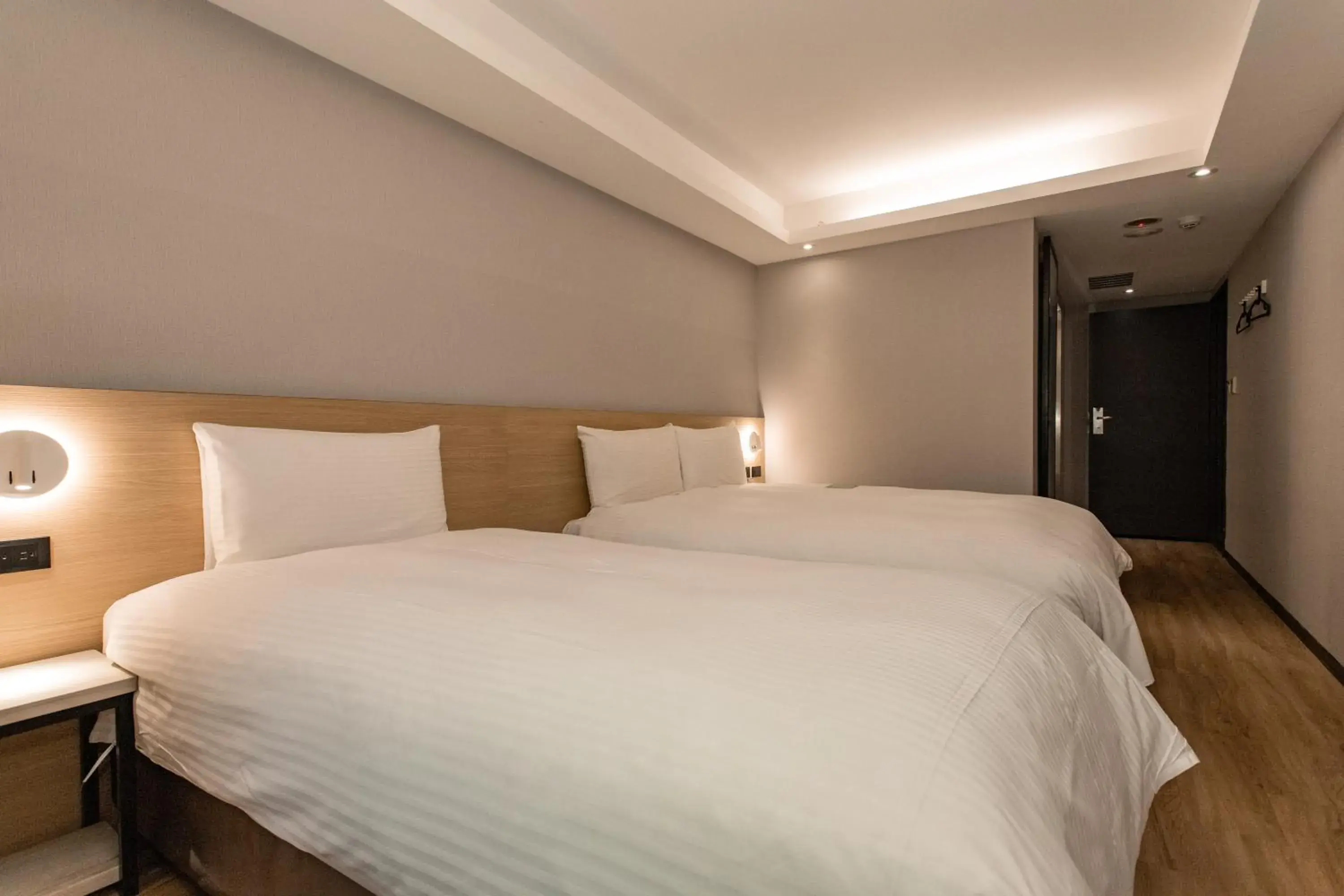 Bed in Hub Hotel Tucheng