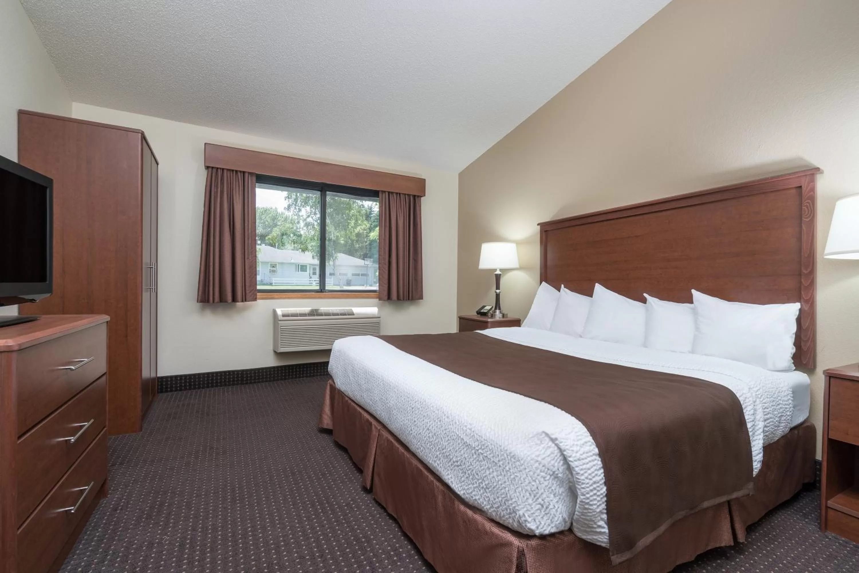 Photo of the whole room, Bed in AmericInn by Wyndham Lake City