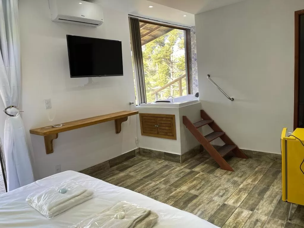 Bed in Pousada R.N.C. Nosso Paraíso