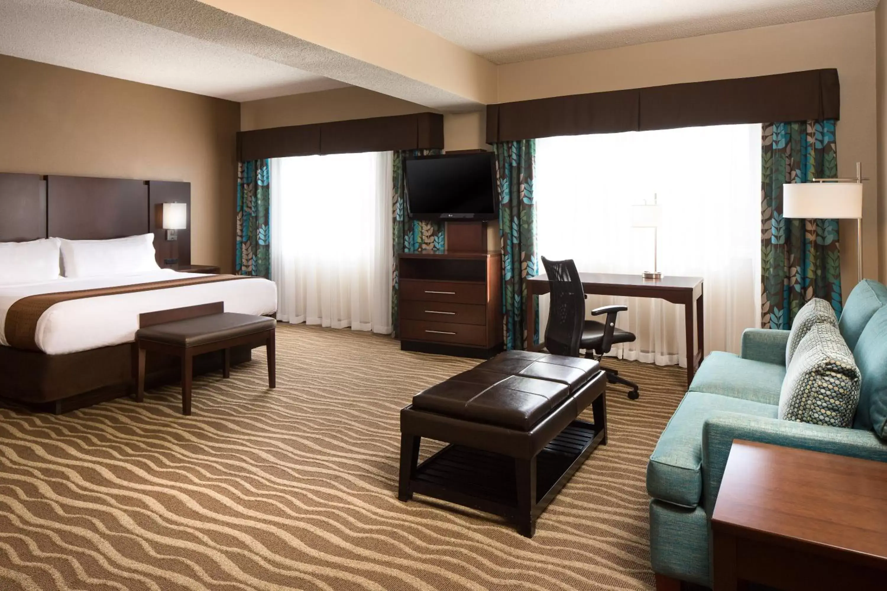 Photo of the whole room, TV/Entertainment Center in Holiday Inn Hotel & Suites Overland Park-West, an IHG Hotel