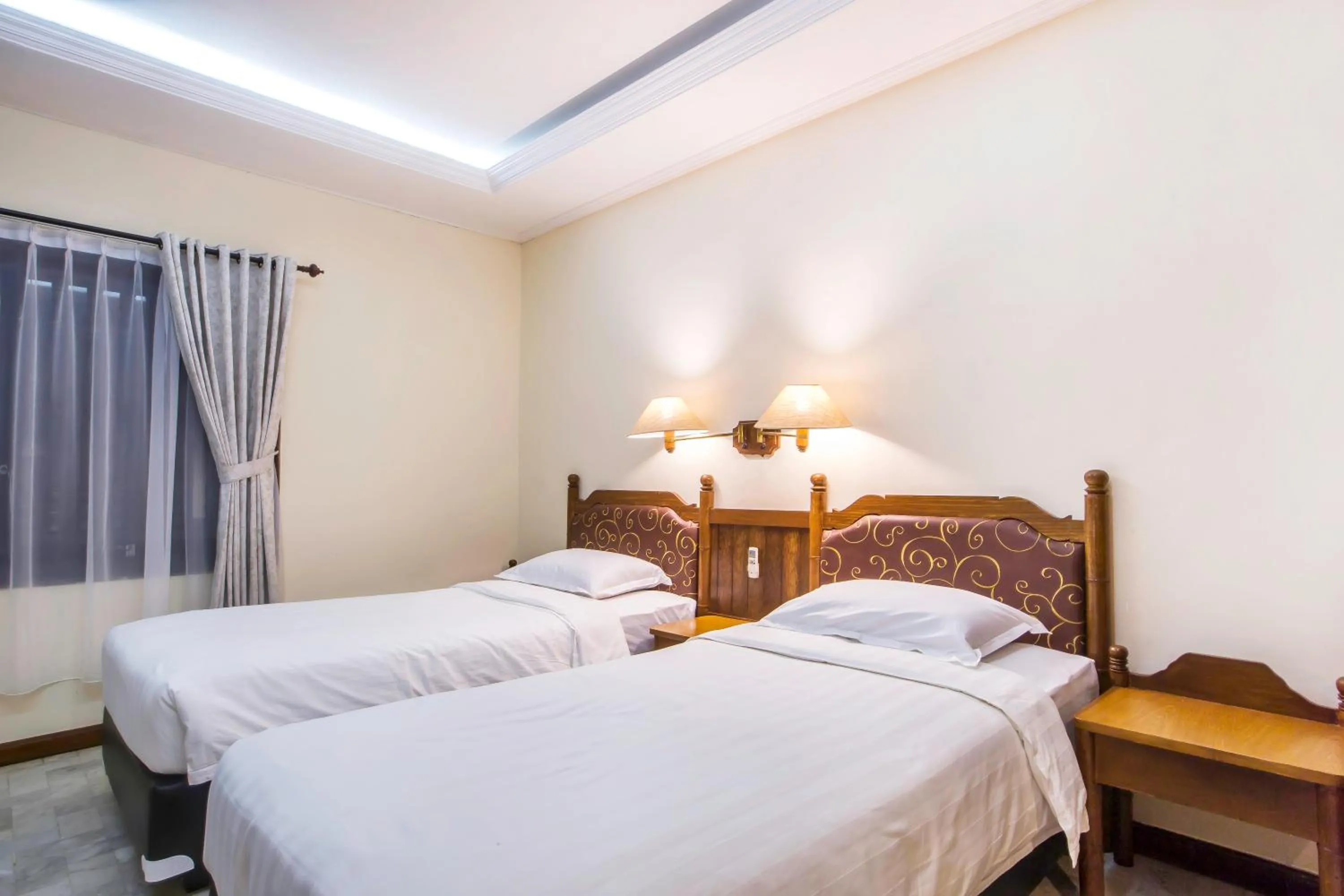 Bed in Bali Bungalo Hotel