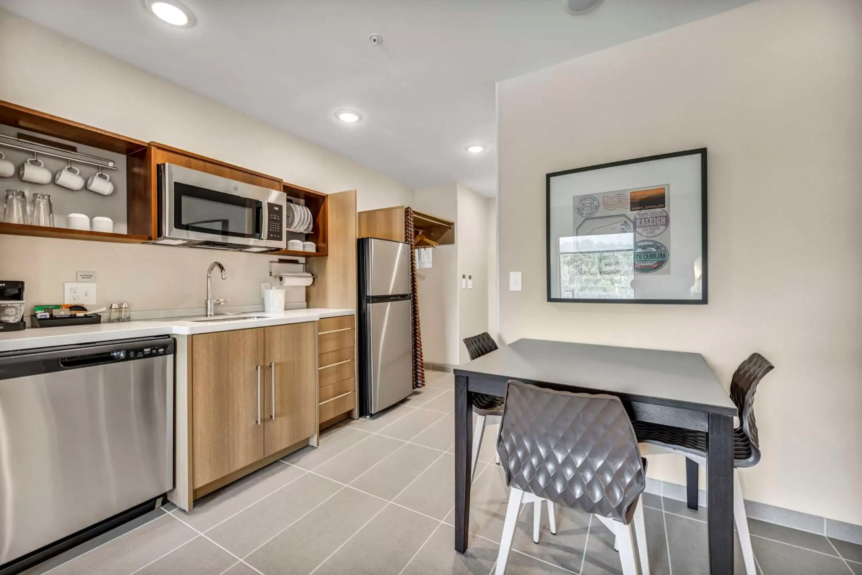 Kitchen or kitchenette, Kitchen/Kitchenette in Home2 Suites By Hilton Raleigh State Arena