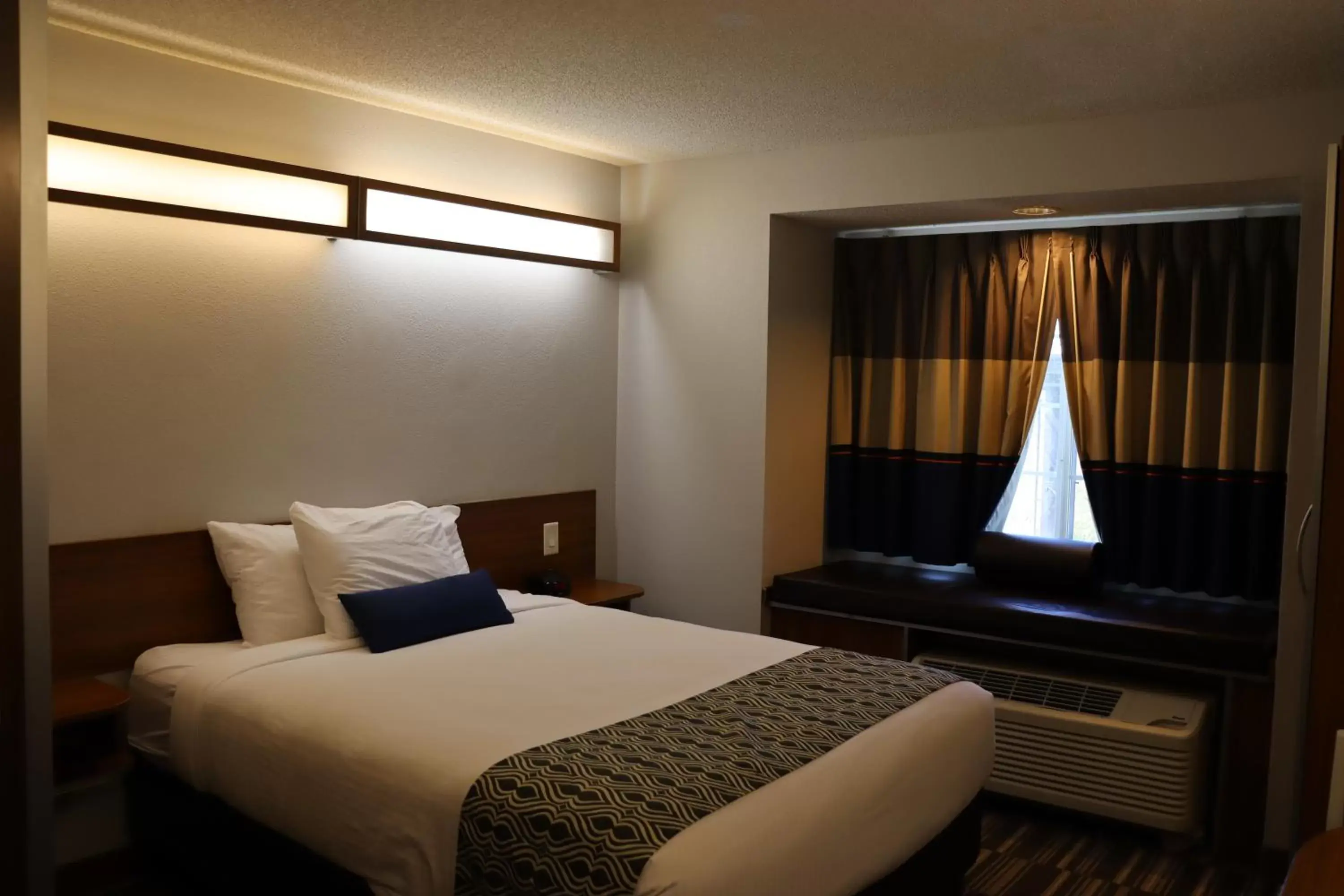 Bed in Microtel Inn & Suites by Wyndham Columbus Near Fort Moore