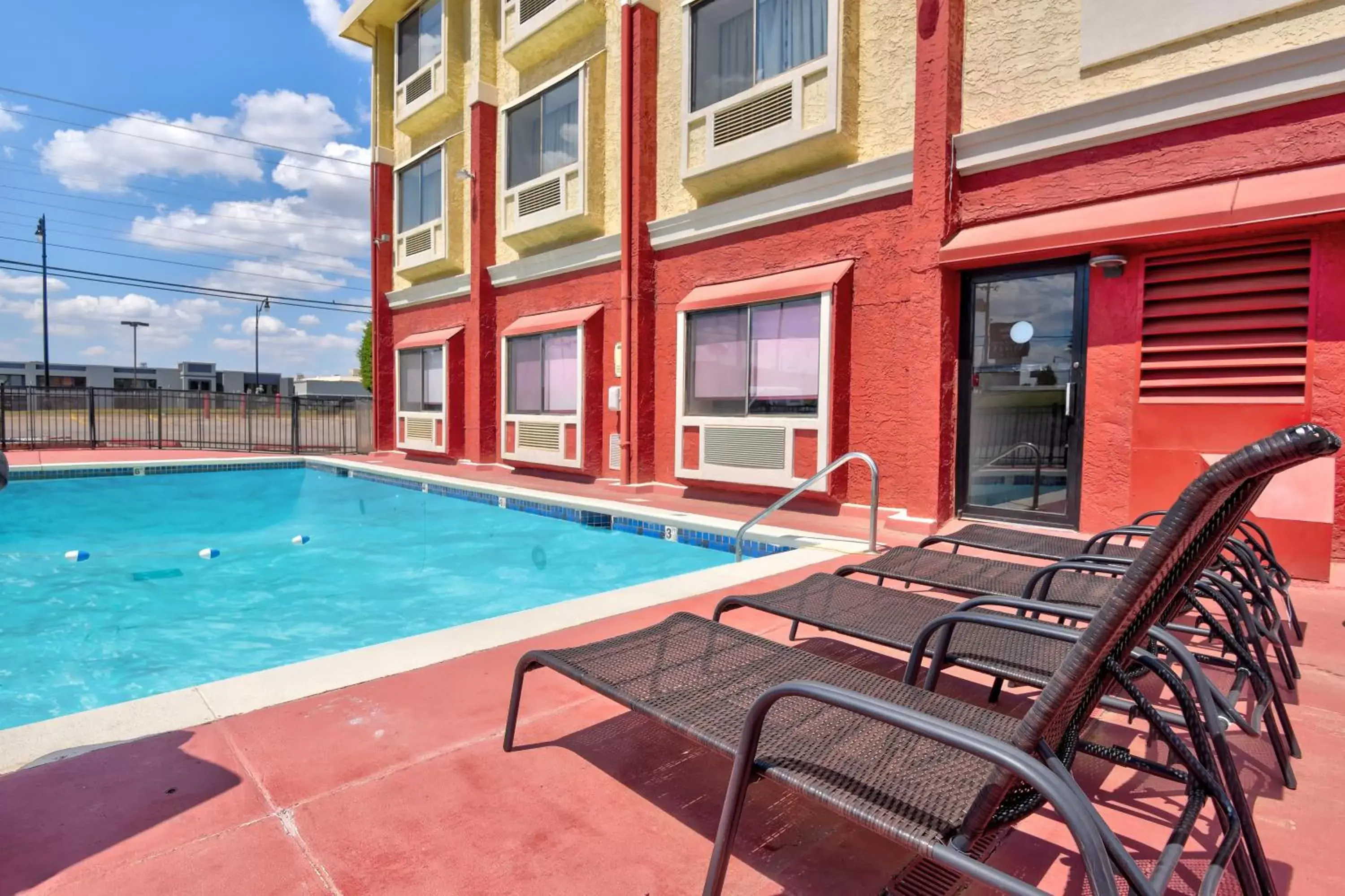 Property building, Swimming Pool in Ramada by Wyndham Oklahoma City Airport North