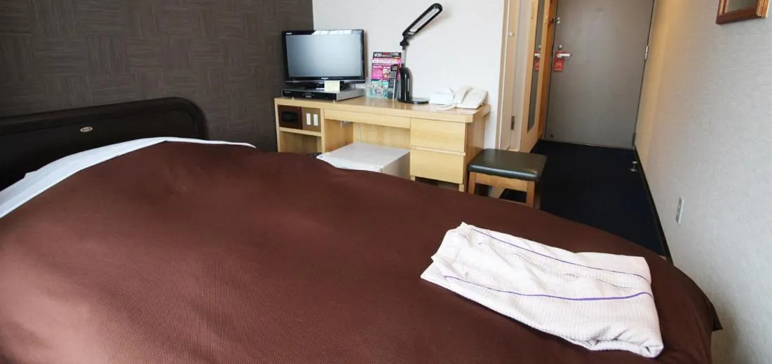 Bed in Takamatsu City Hotel