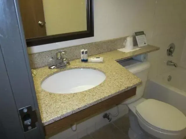 Bathroom in AmericInn by Wyndham West Bend