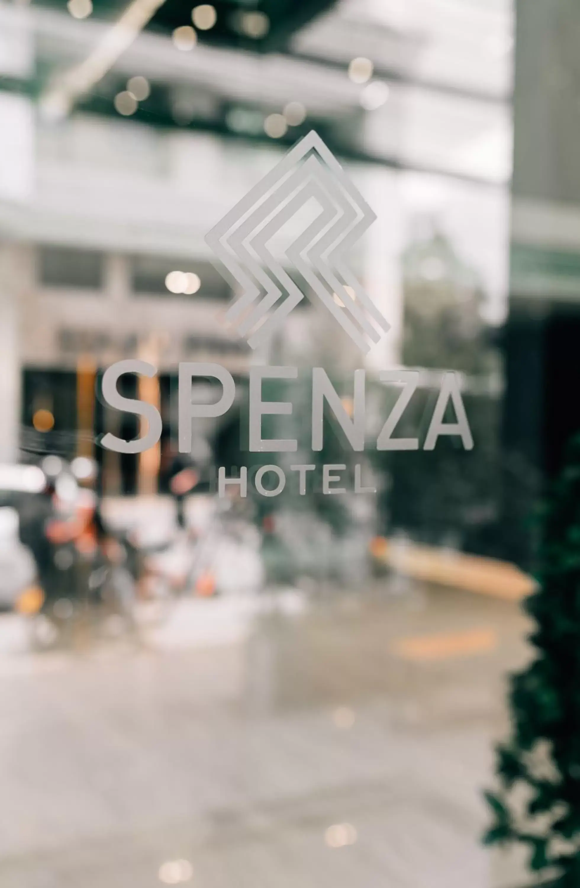 Property logo or sign in Spenza Hotel