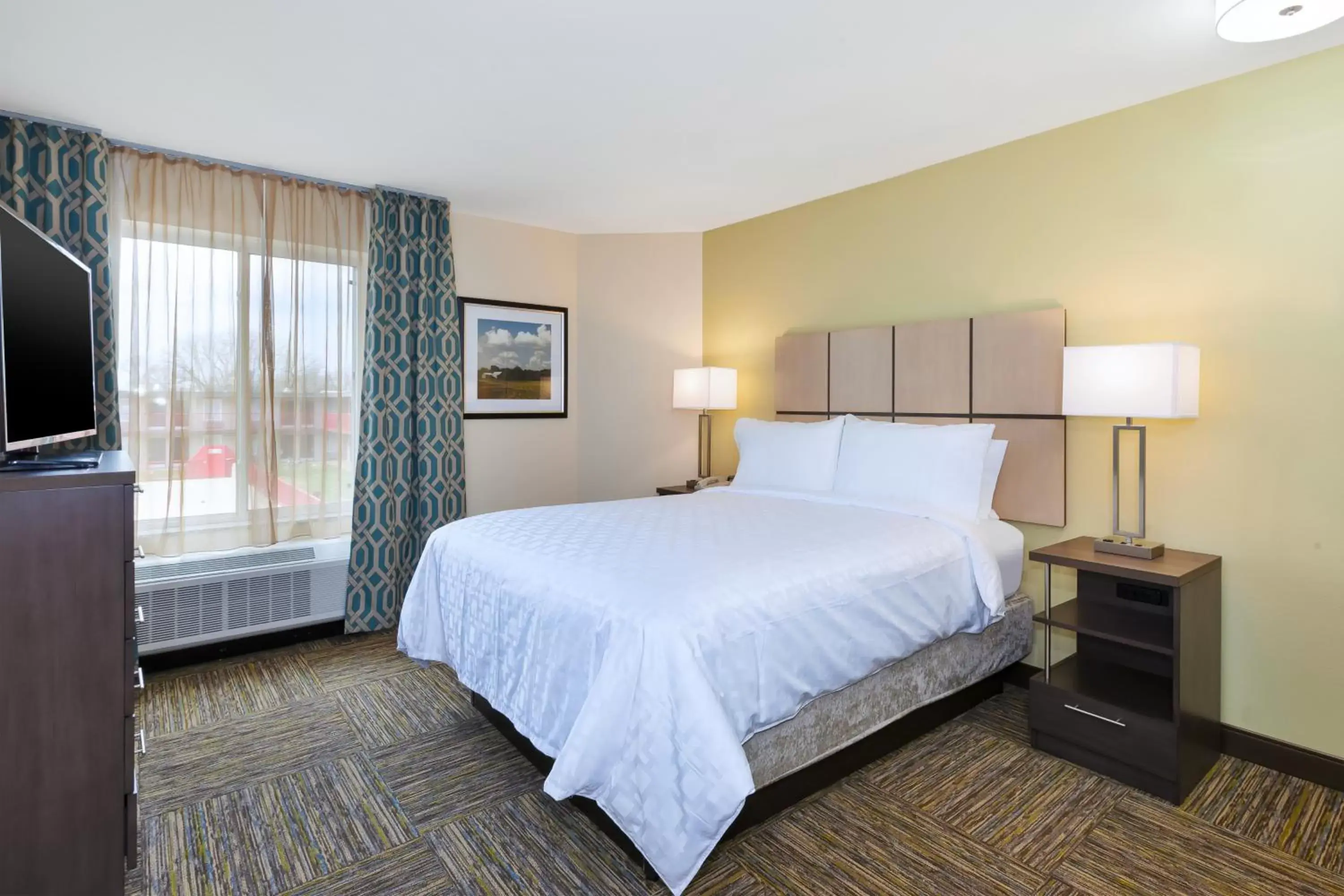 Bed in Candlewood Suites Louisville - NE Downtown Area, an IHG Hotel