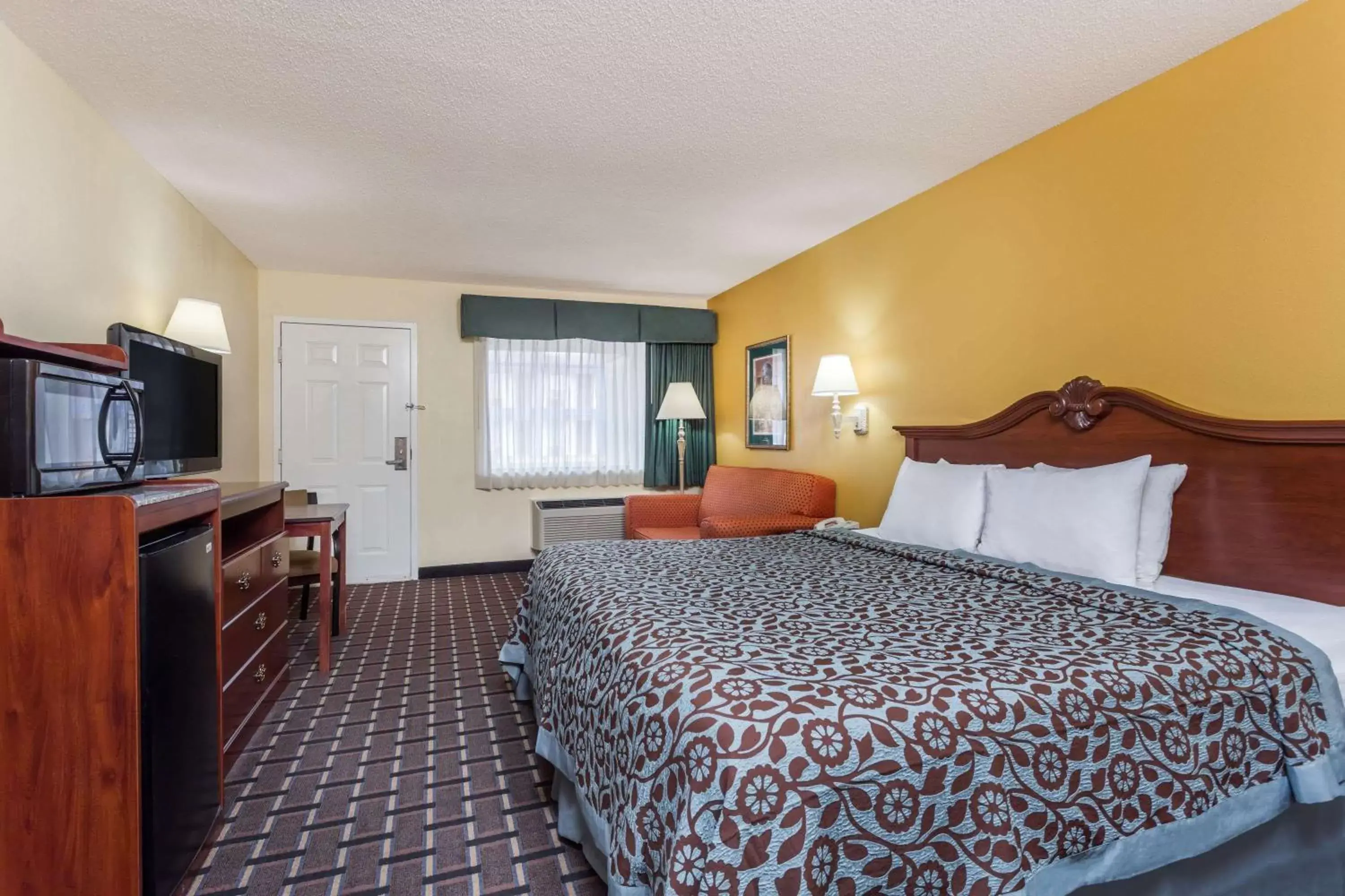 Photo of the whole room in Days Inn & Suites by Wyndham Warner Robins Near Robins AFB