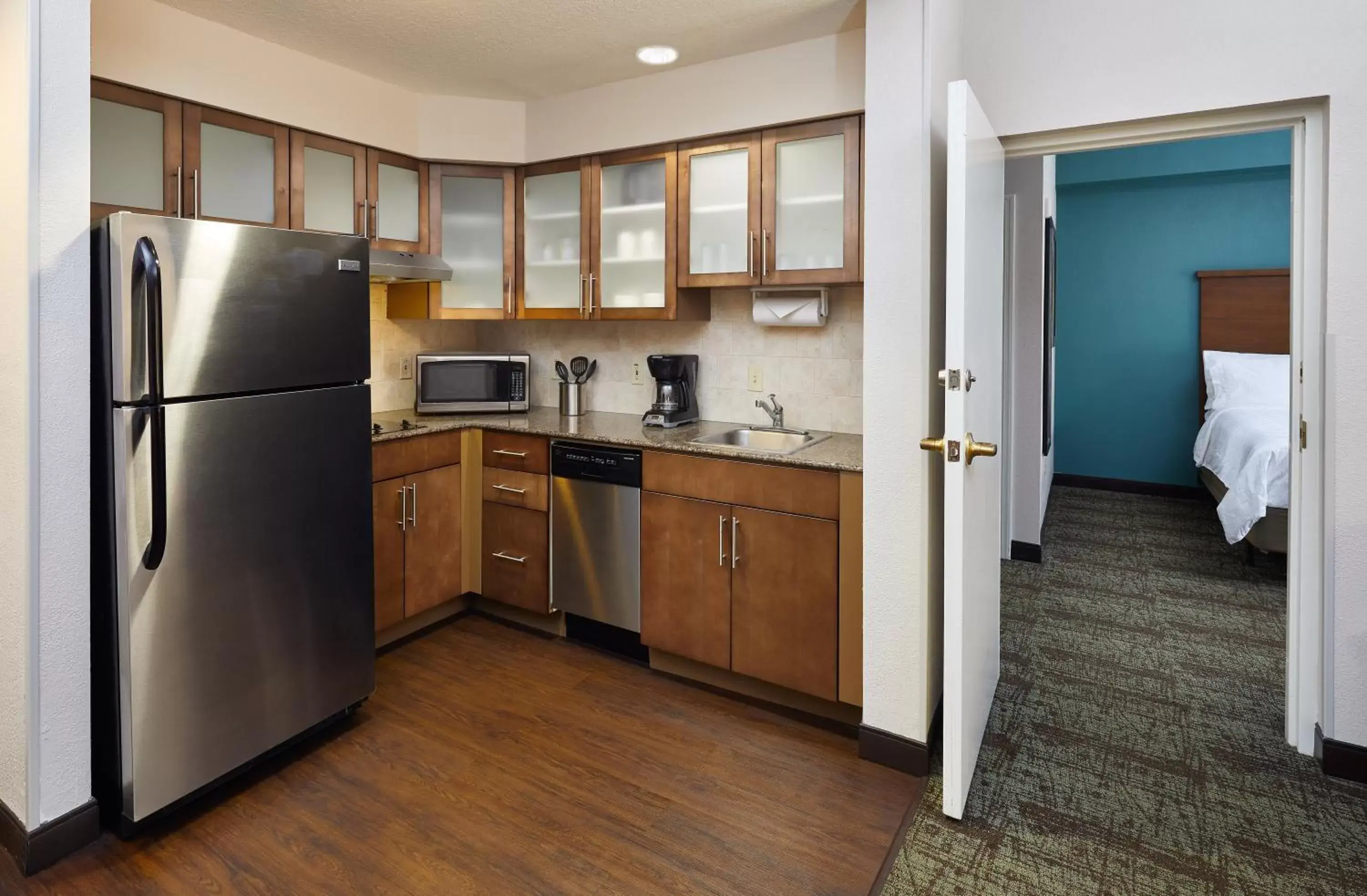 Photo of the whole room, Kitchen/Kitchenette in Staybridge Suites Orlando South, an IHG Hotel