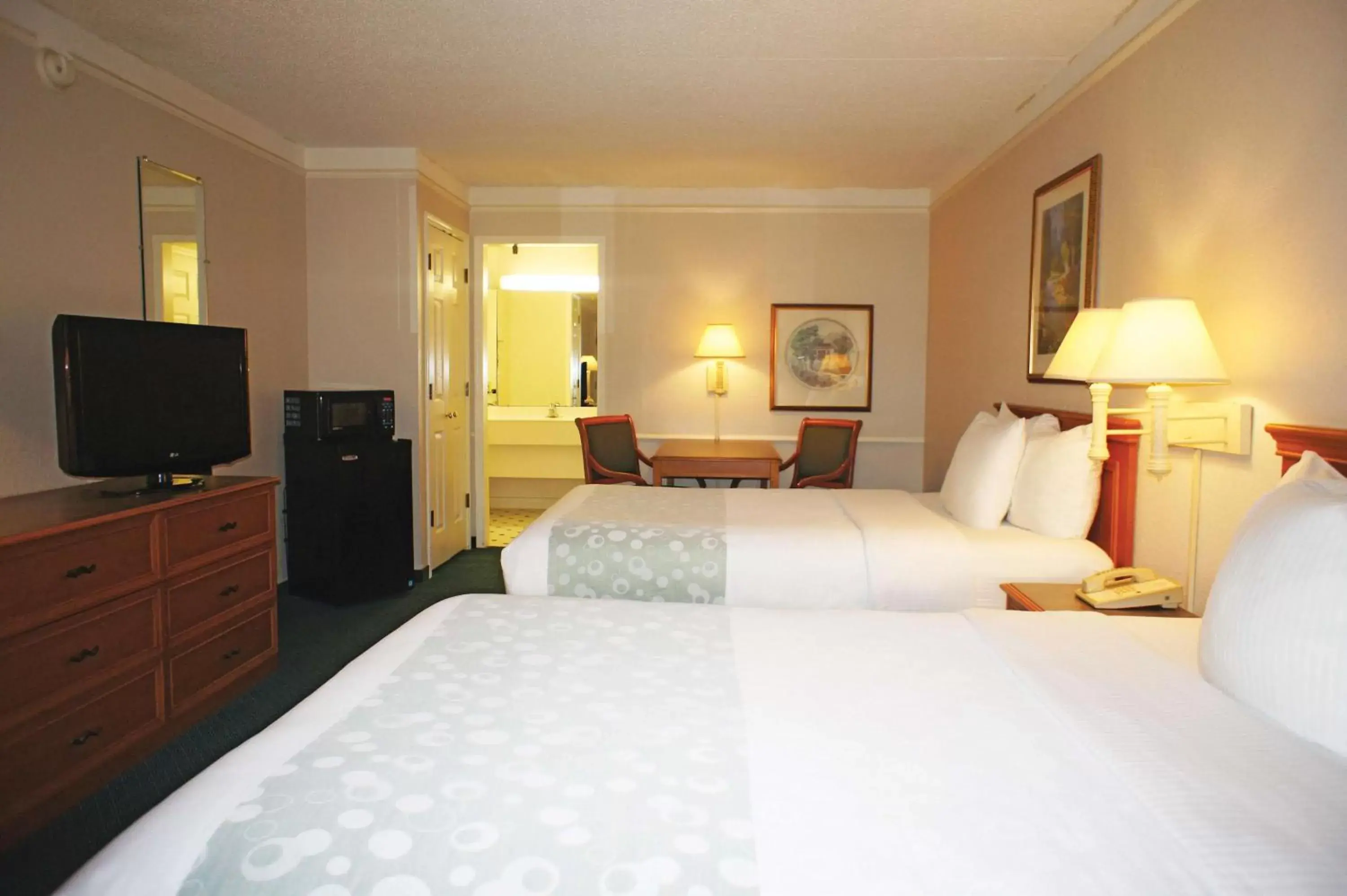 Photo of the whole room, Bed in La Quinta Inn by Wyndham Tampa Bay Pinellas Park Clearwater