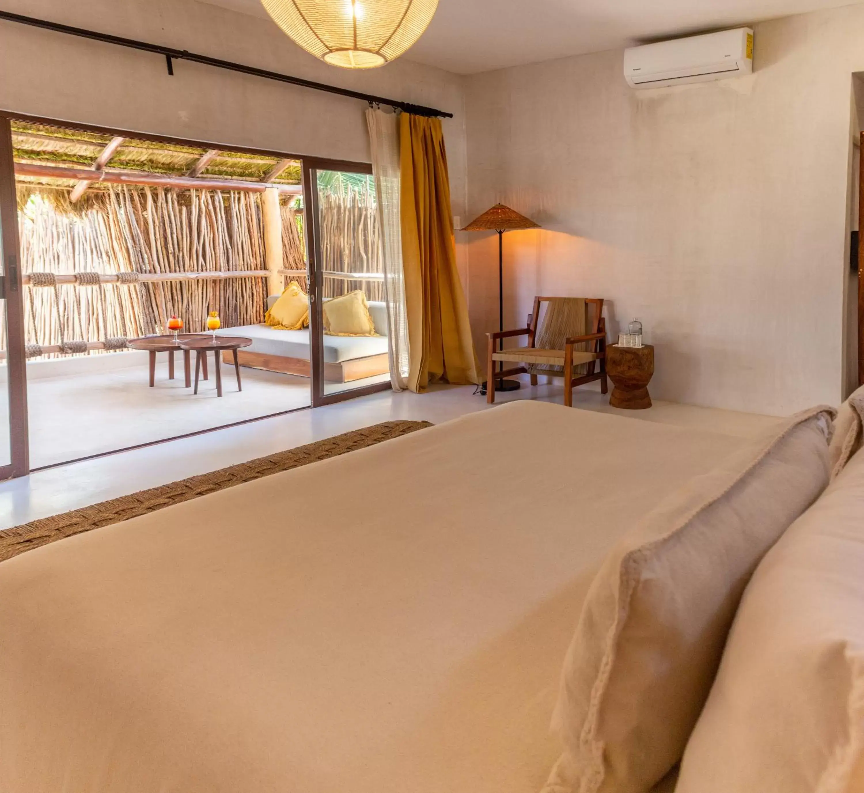 Bed in Dune Boutique Hotel located at the party zone