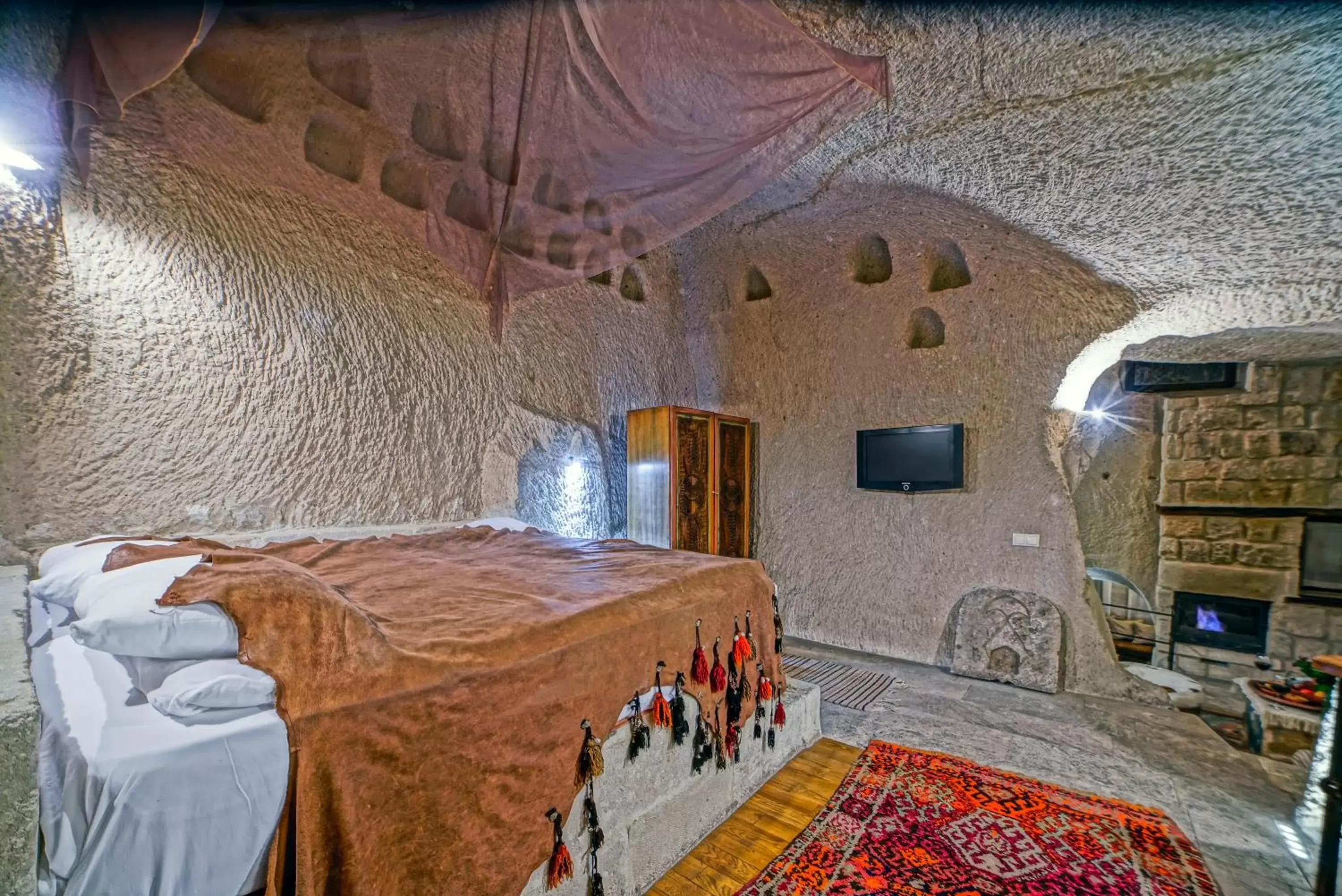 Bed in Anatolian Houses Cave Hotel & SPA