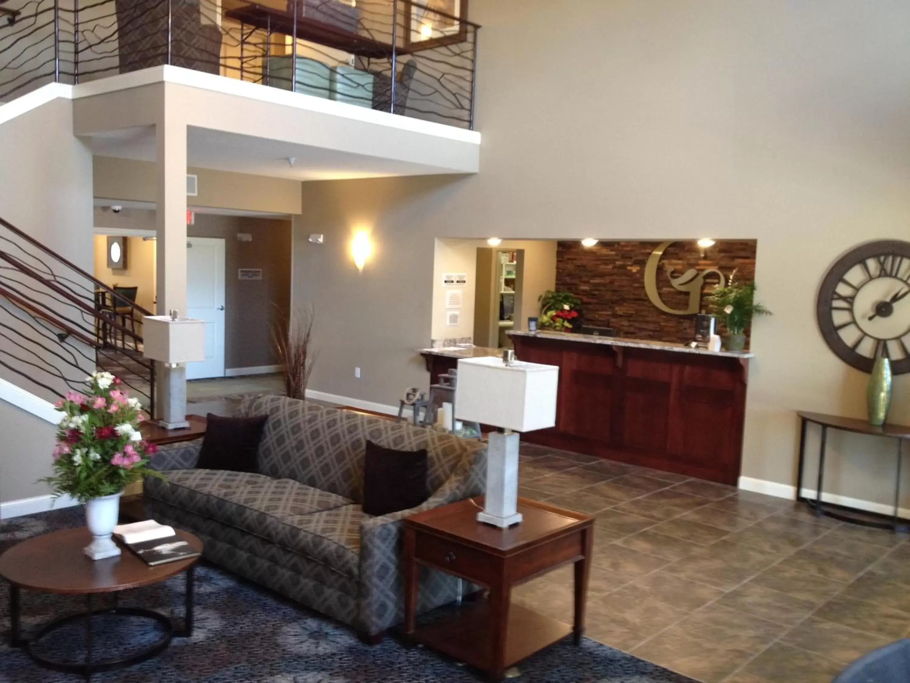 Communal lounge/ TV room, Lobby/Reception in GrandStay Hotel & Suites - Glenwood