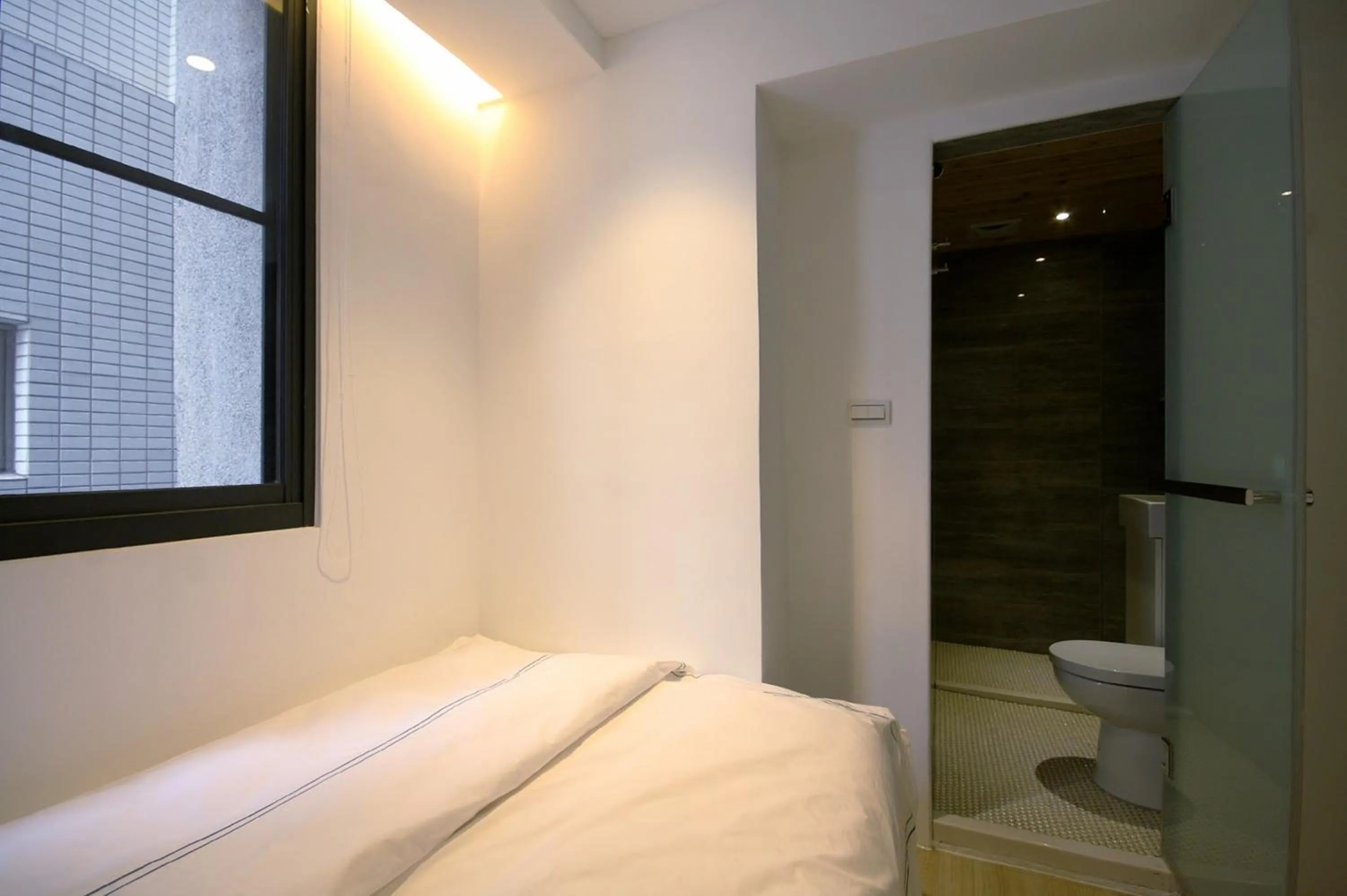 Bed in Mini West Hotel