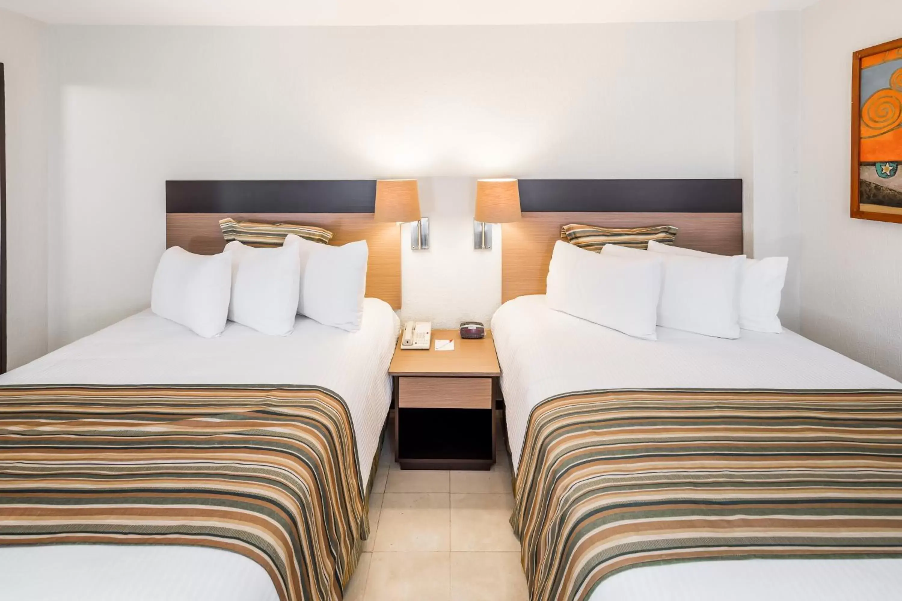 Decorative detail, Bed in Ramada Hola Culiacan Decorative detail, Bed in Ramada Hola Culiacan