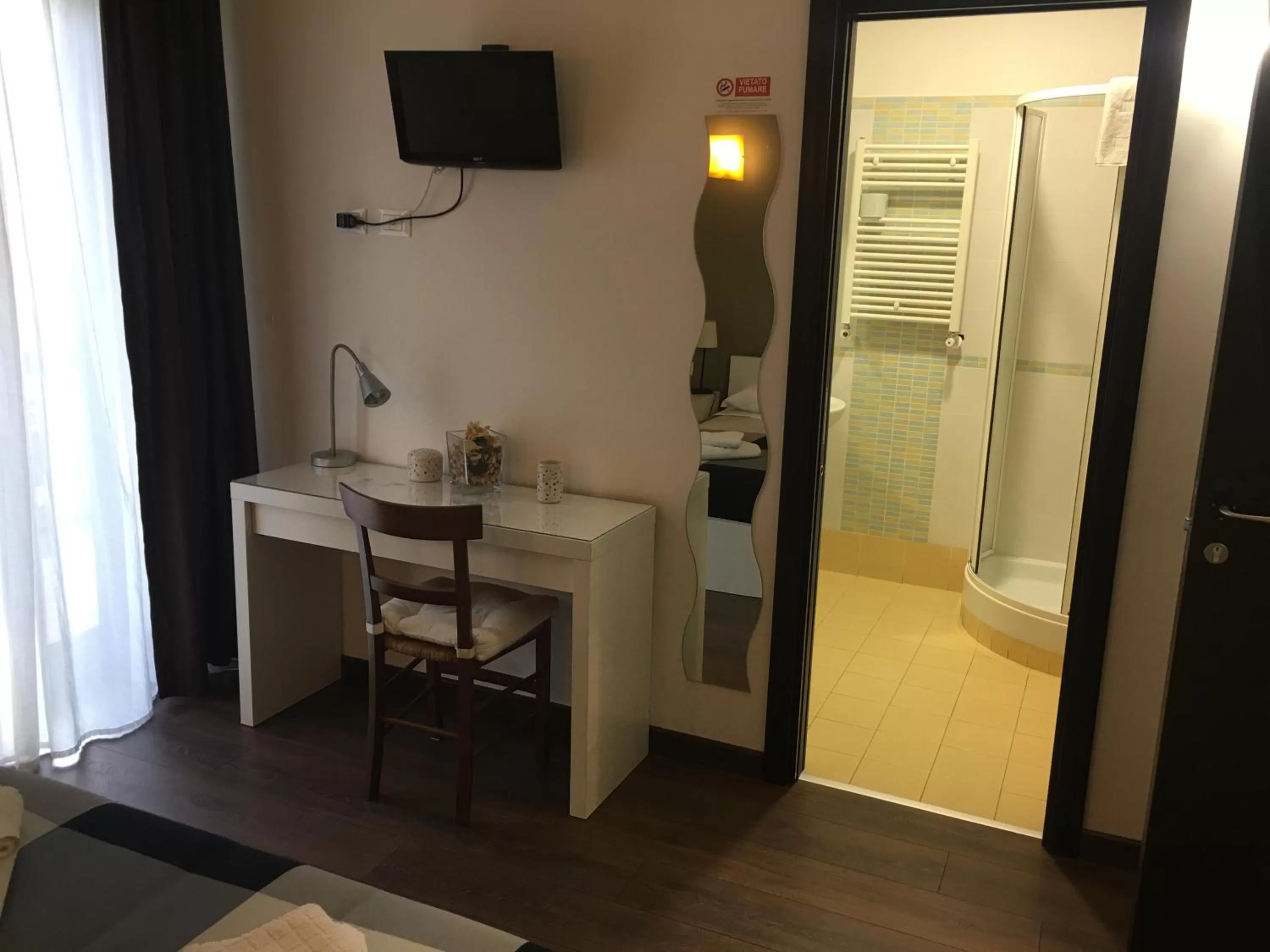 Bathroom, TV/Entertainment Center in Almi Rooms