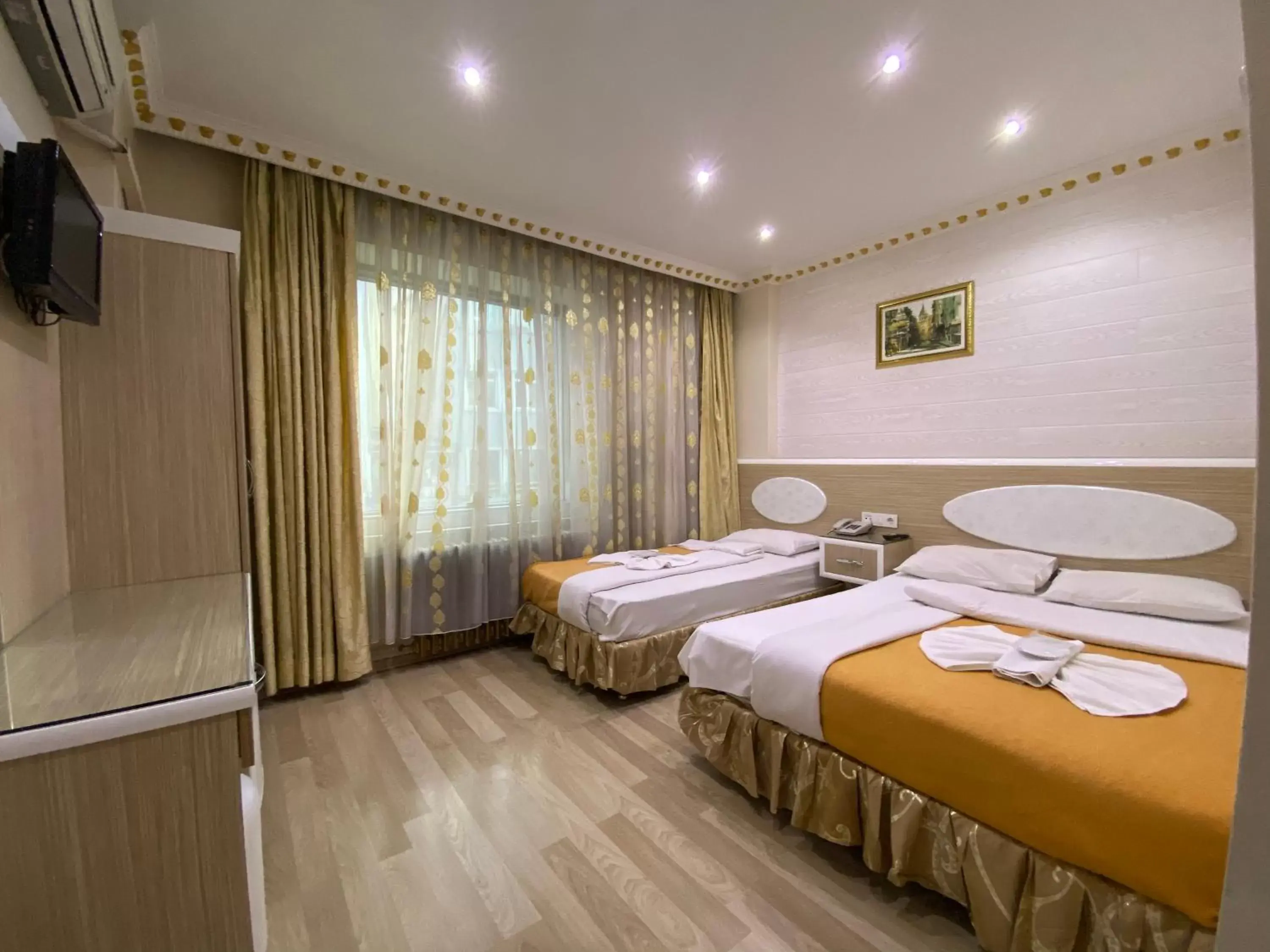 Bed in Grand Oral Hotel