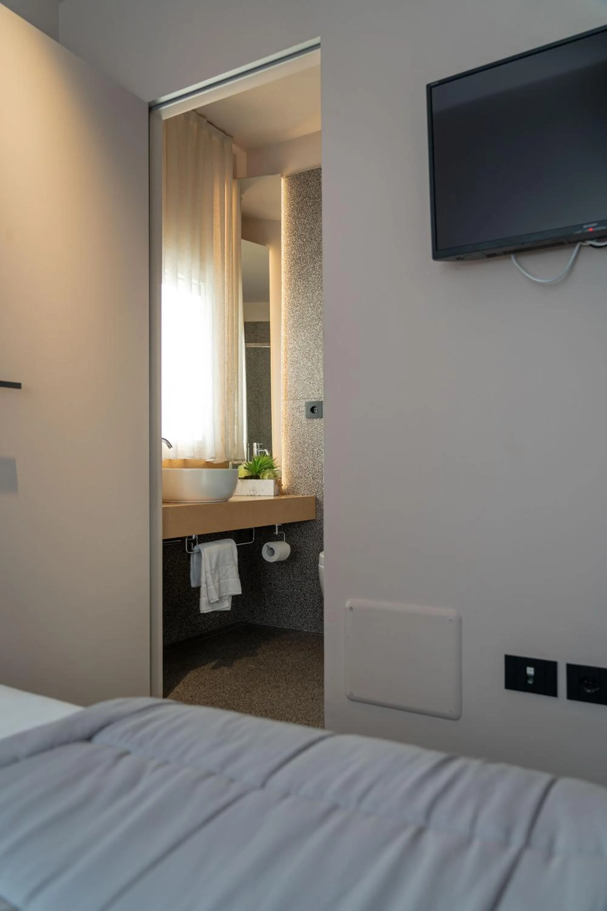 Bed in Elide Design Hotel