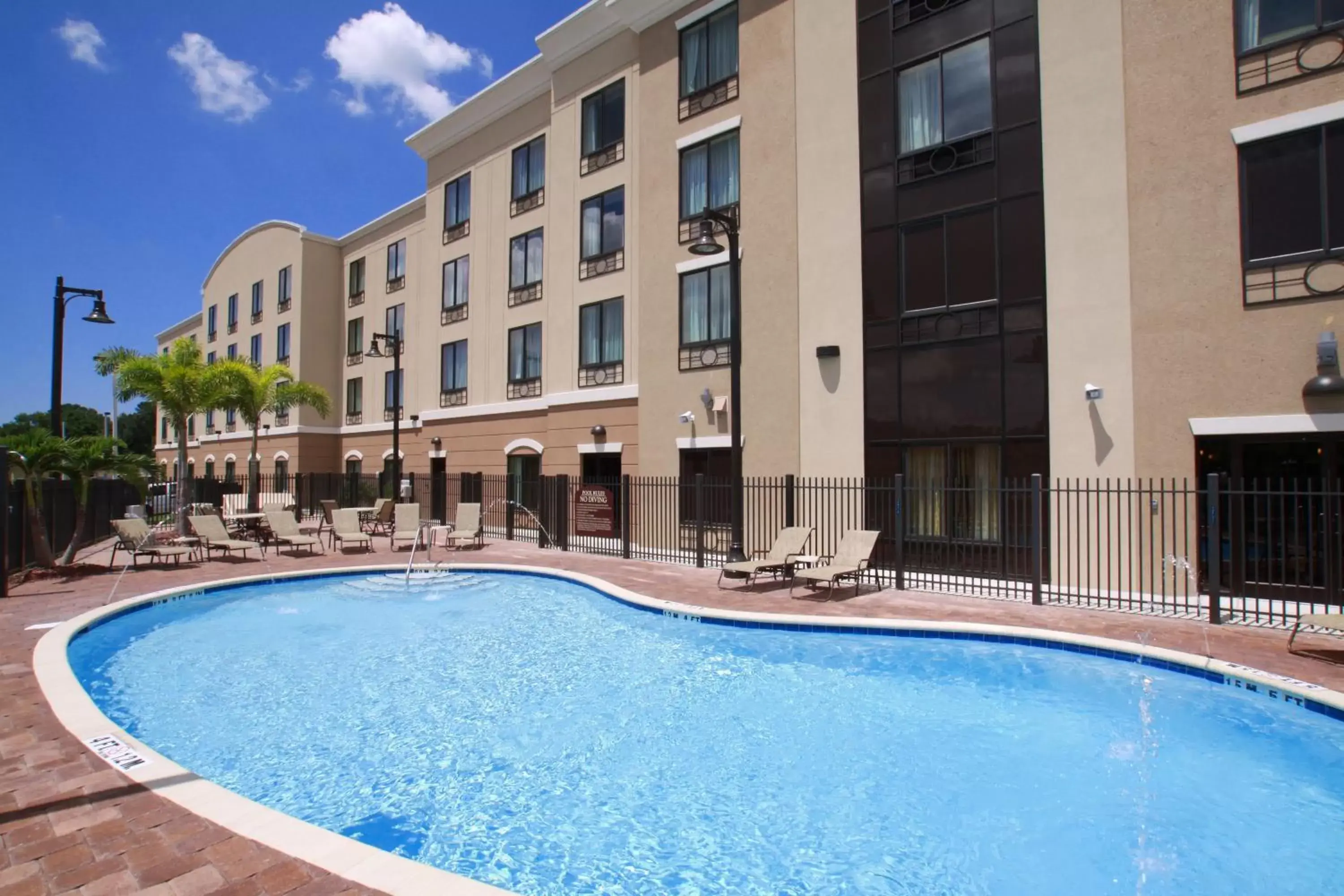 Swimming pool, Property Building in Holiday Inn Express Hotel & Suites Tampa-USF-Busch Gardens, an IHG Hotel