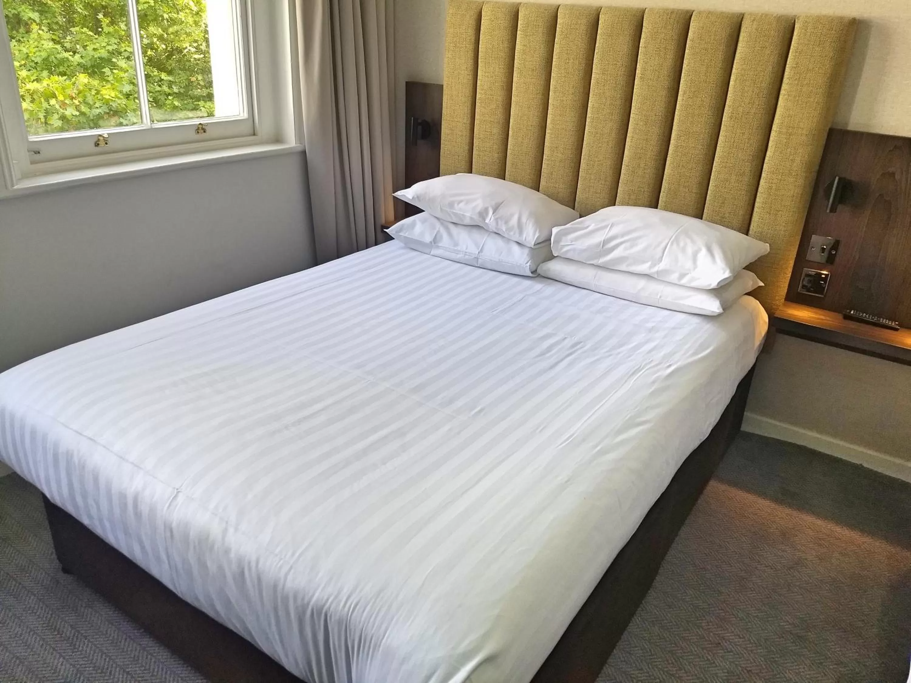 Bed in Garden Court Hotel