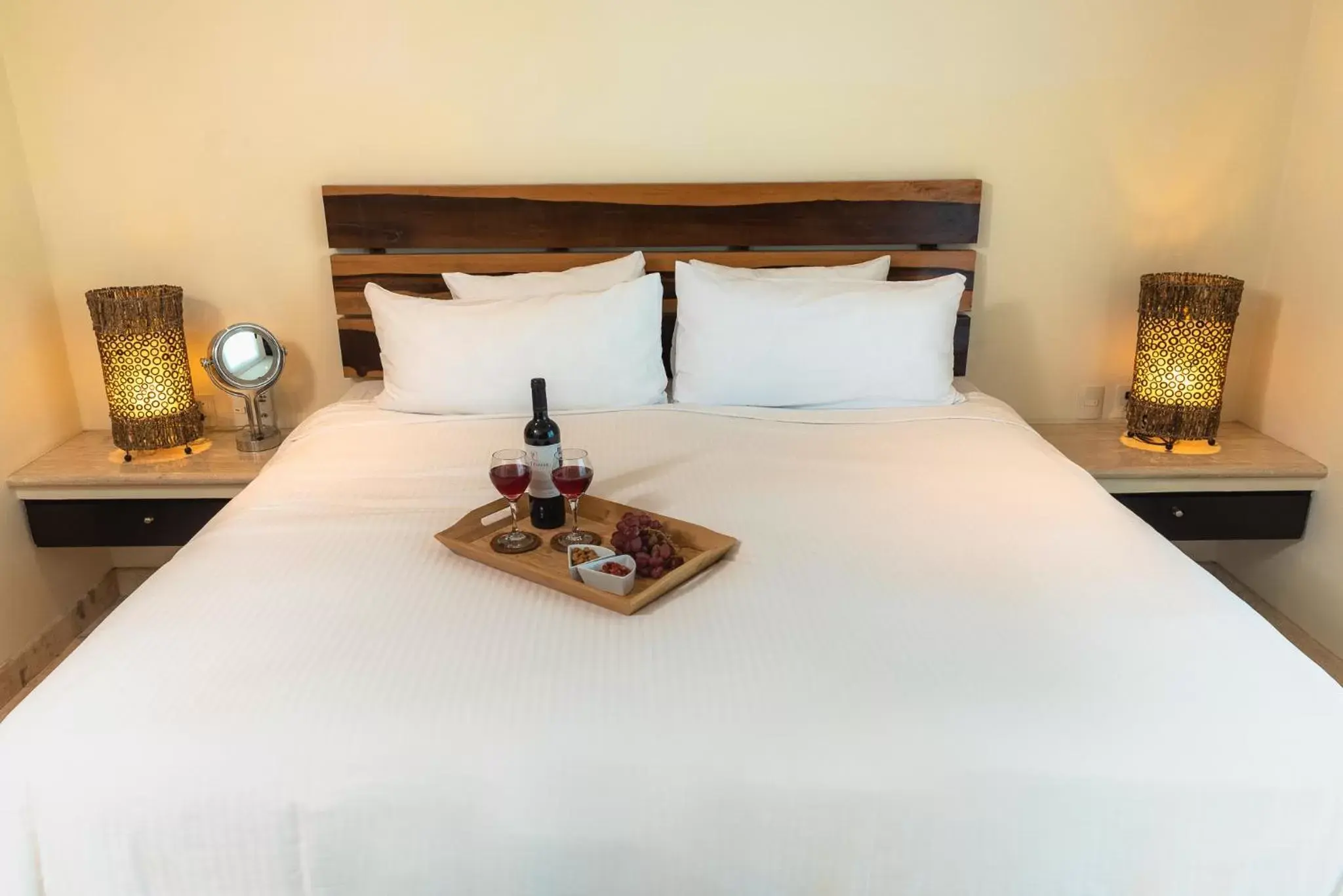 Bed in El Taj Oceanfront and Beachside Condo Hotel