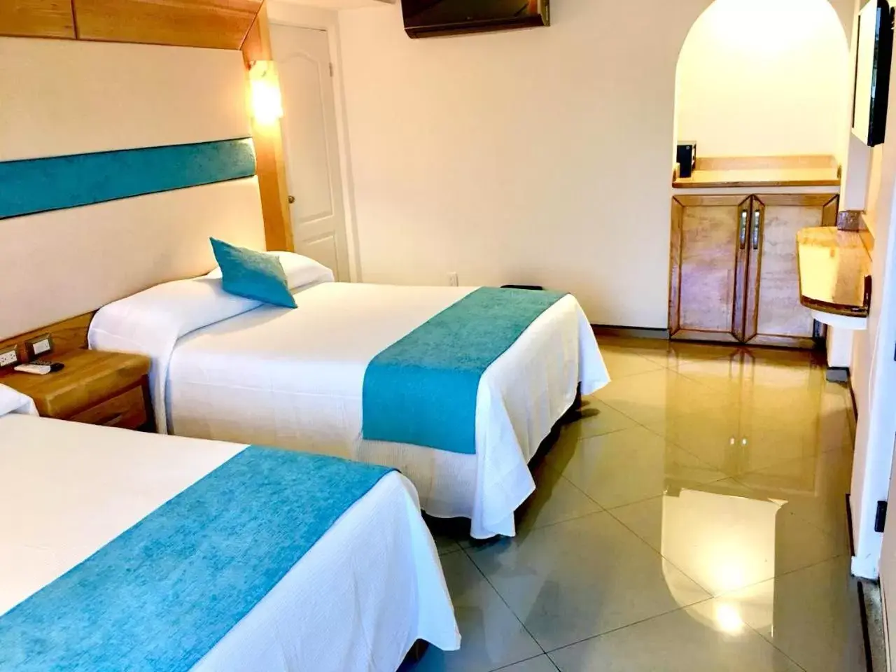 Bed in Hotel Blue Star Cancun