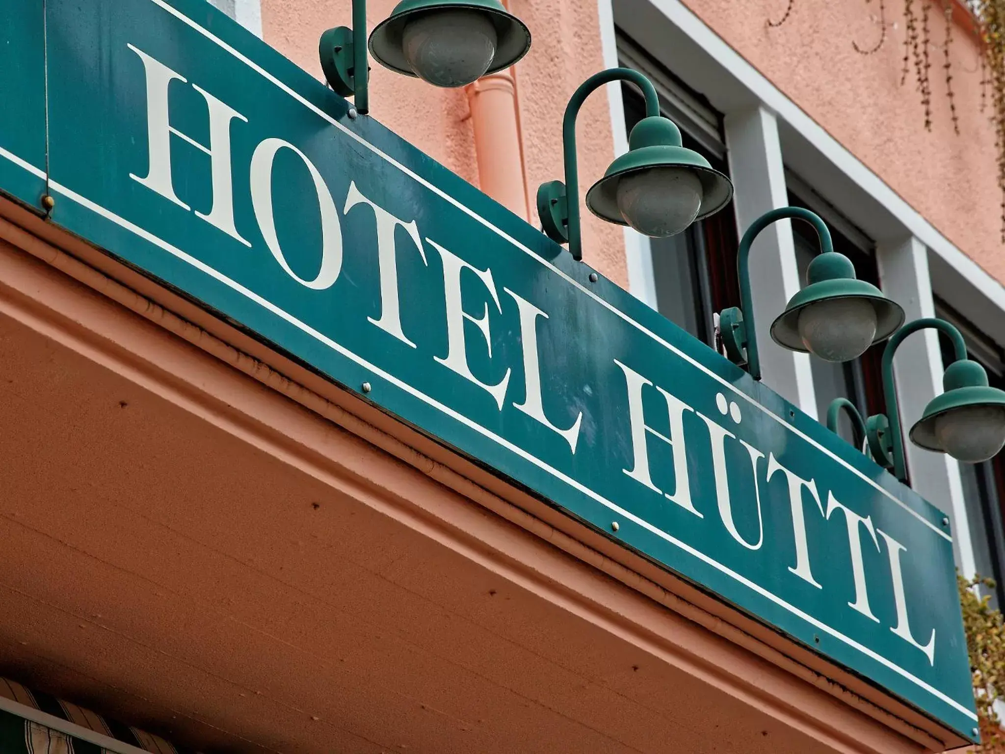 Facade/entrance, Property Logo/Sign in Hotel Hüttl - Garni