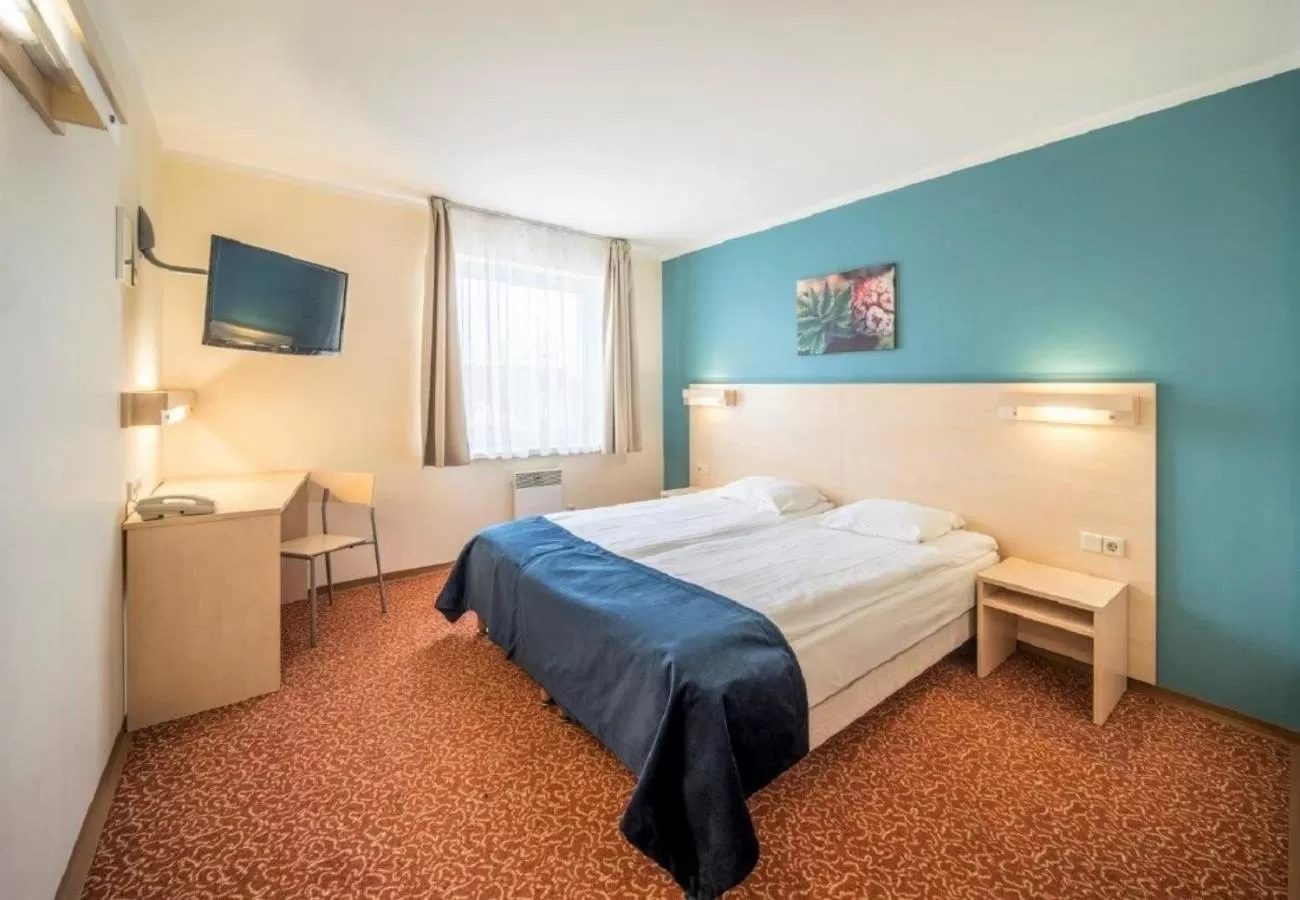 Bed in Rija Bauska Hotel