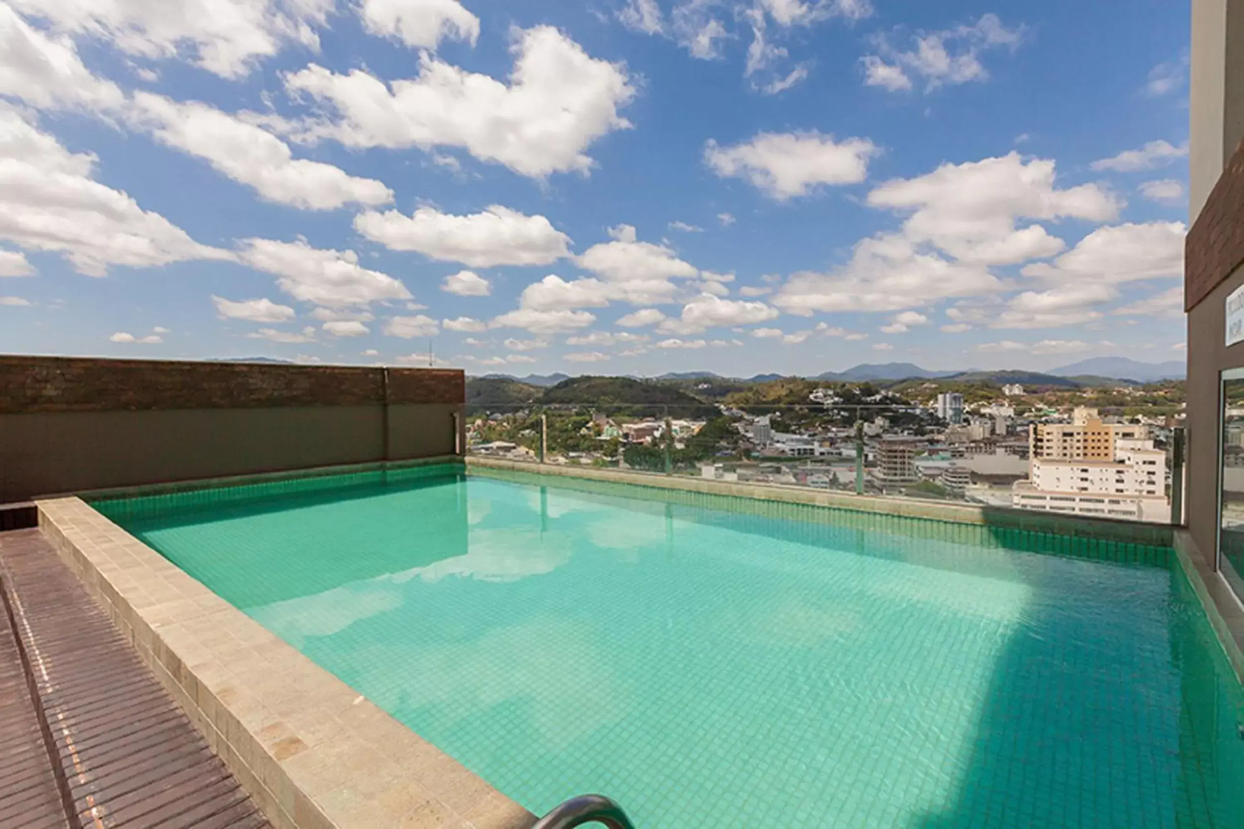 Balcony/Terrace, Swimming Pool in Tri Hotel Executive Brusque