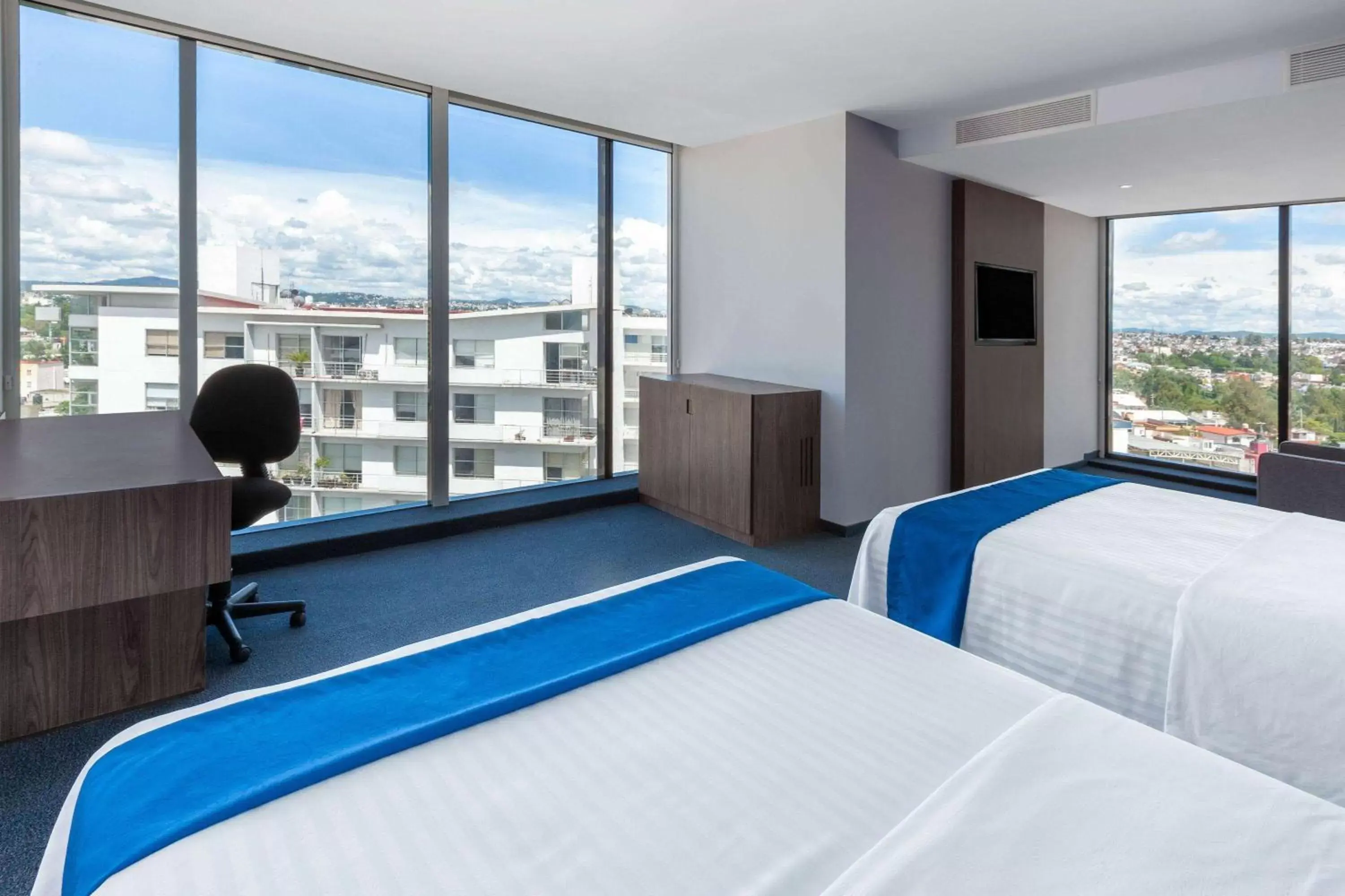 Photo of the whole room, Bed in Wyndham Puebla Angelopolis Photo of the whole room, Bed in Wyndham Puebla Angelopolis