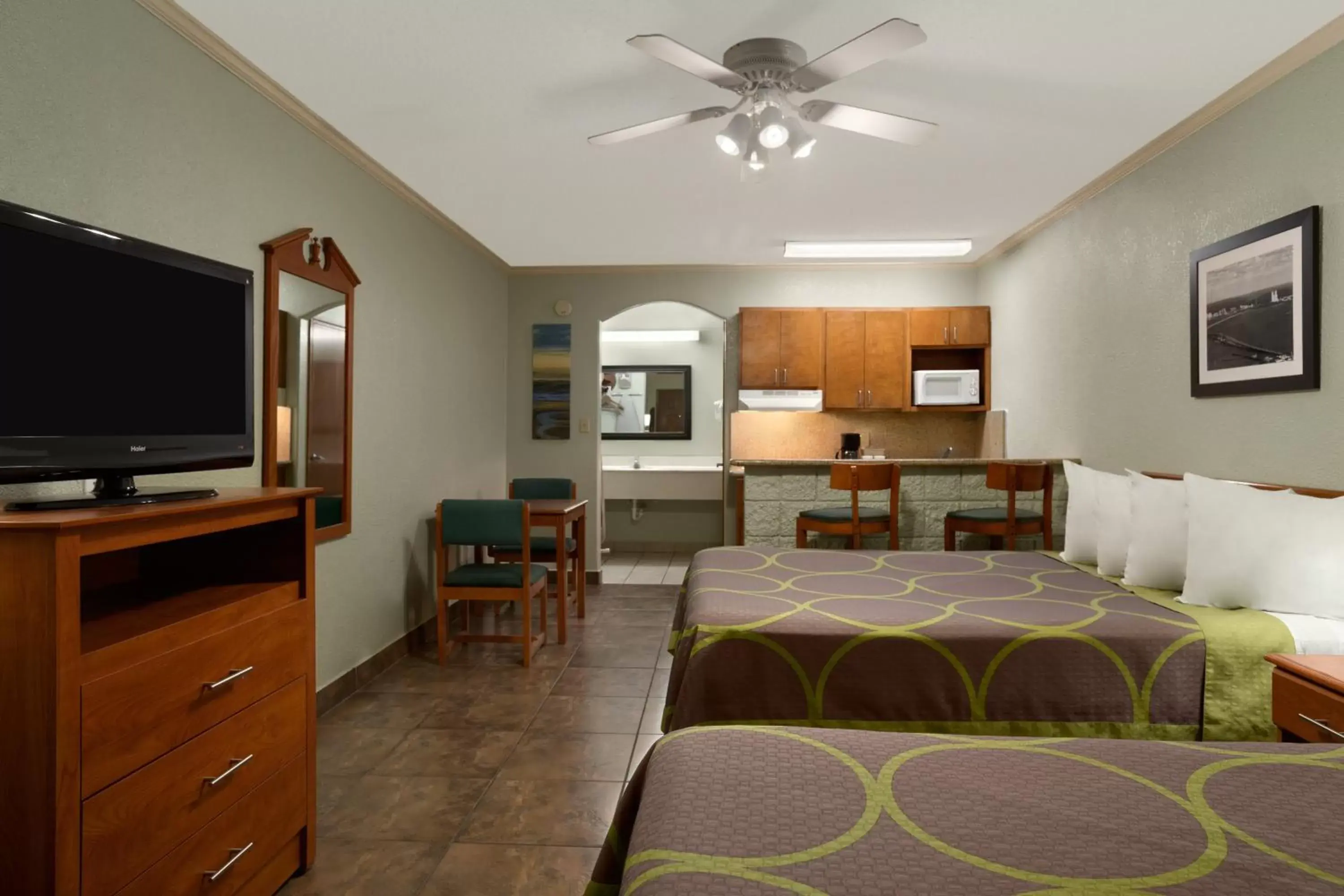 Bedroom, TV/Entertainment Center in Super 8 by Wyndham South Padre Island