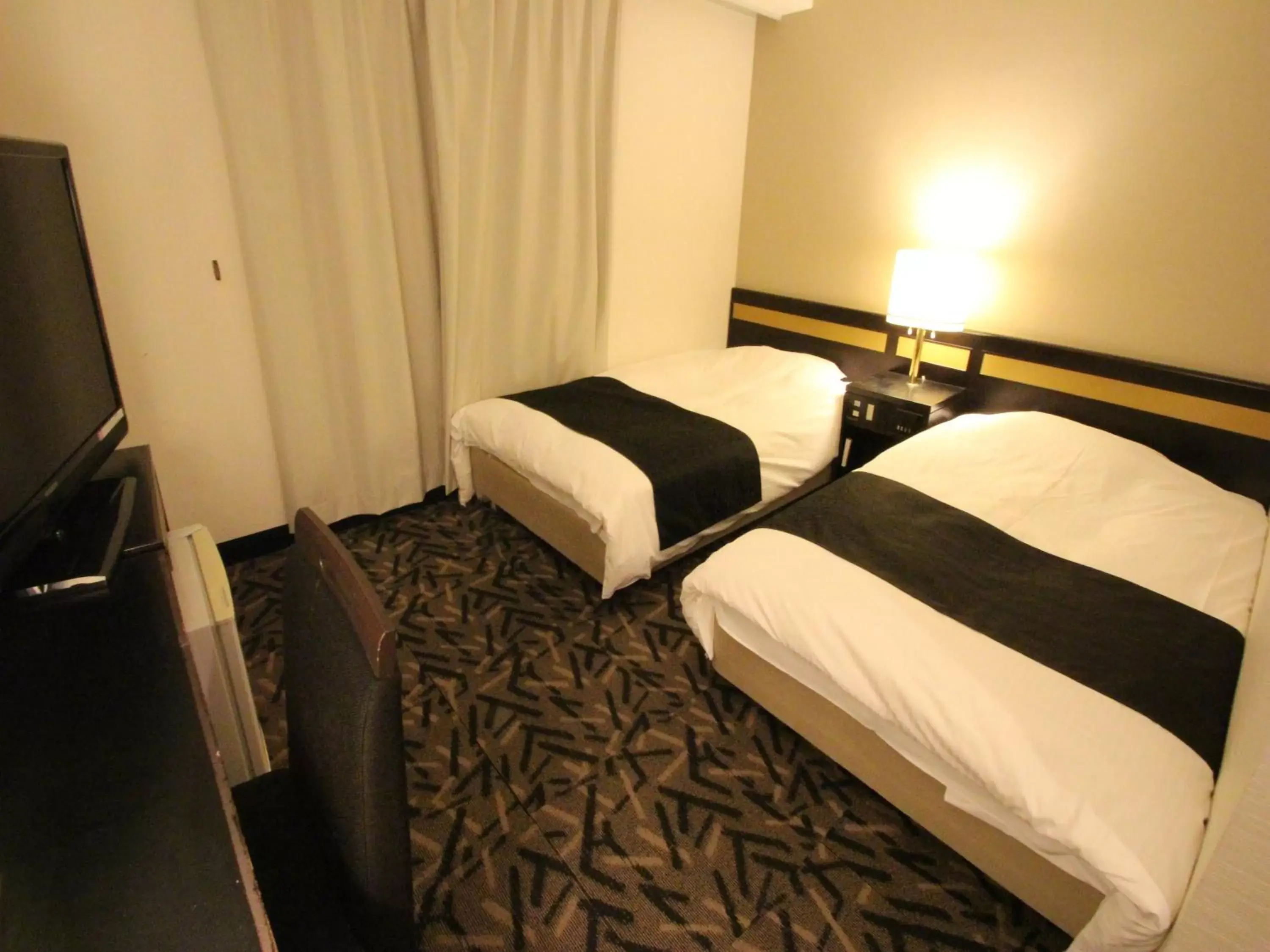 Photo of the whole room, Bed in APA Hotel Komatsu Grand