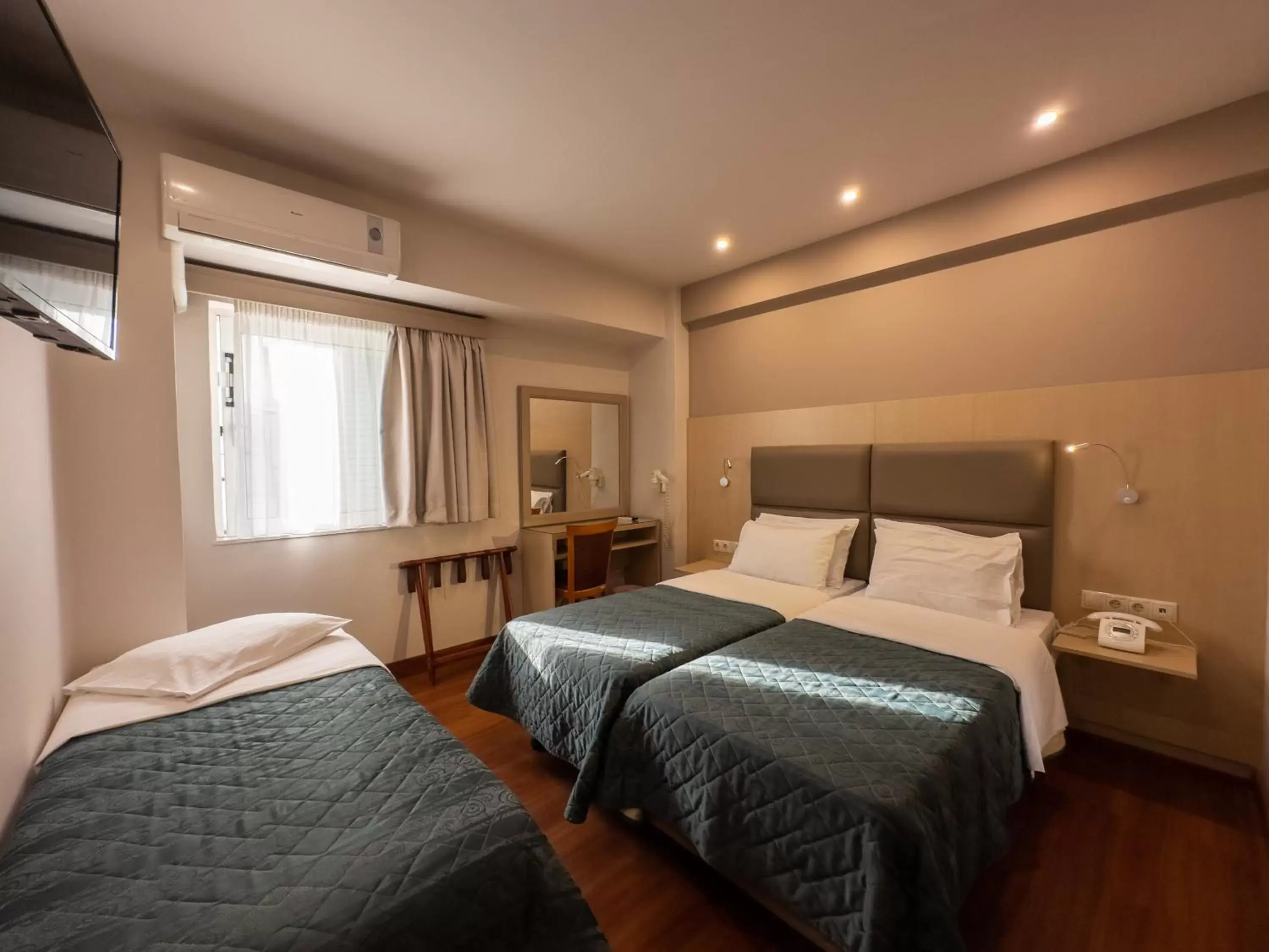Bed in Anemoni Piraeus Hotel