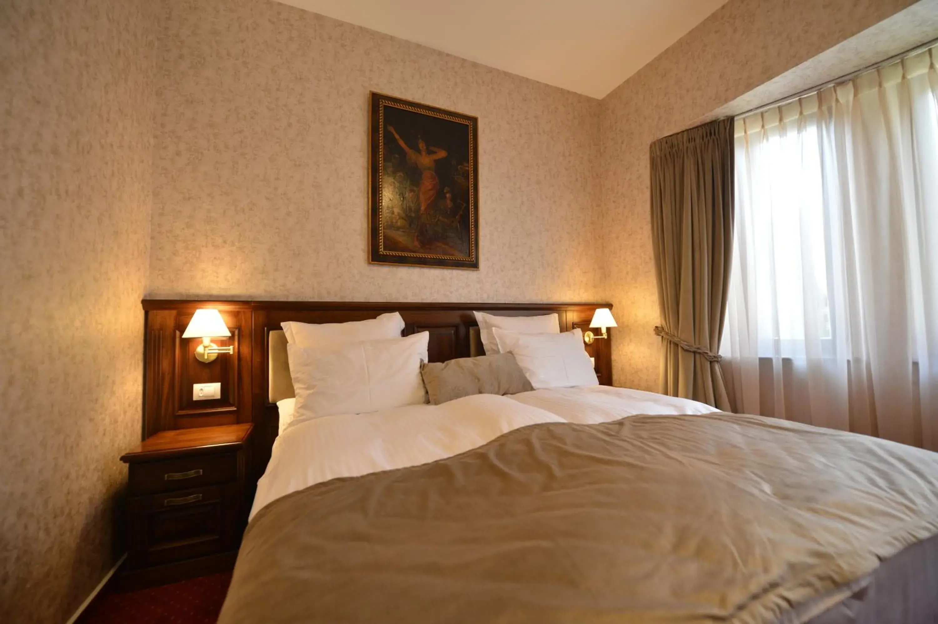 Bed in Noblesse Boutique Hotel