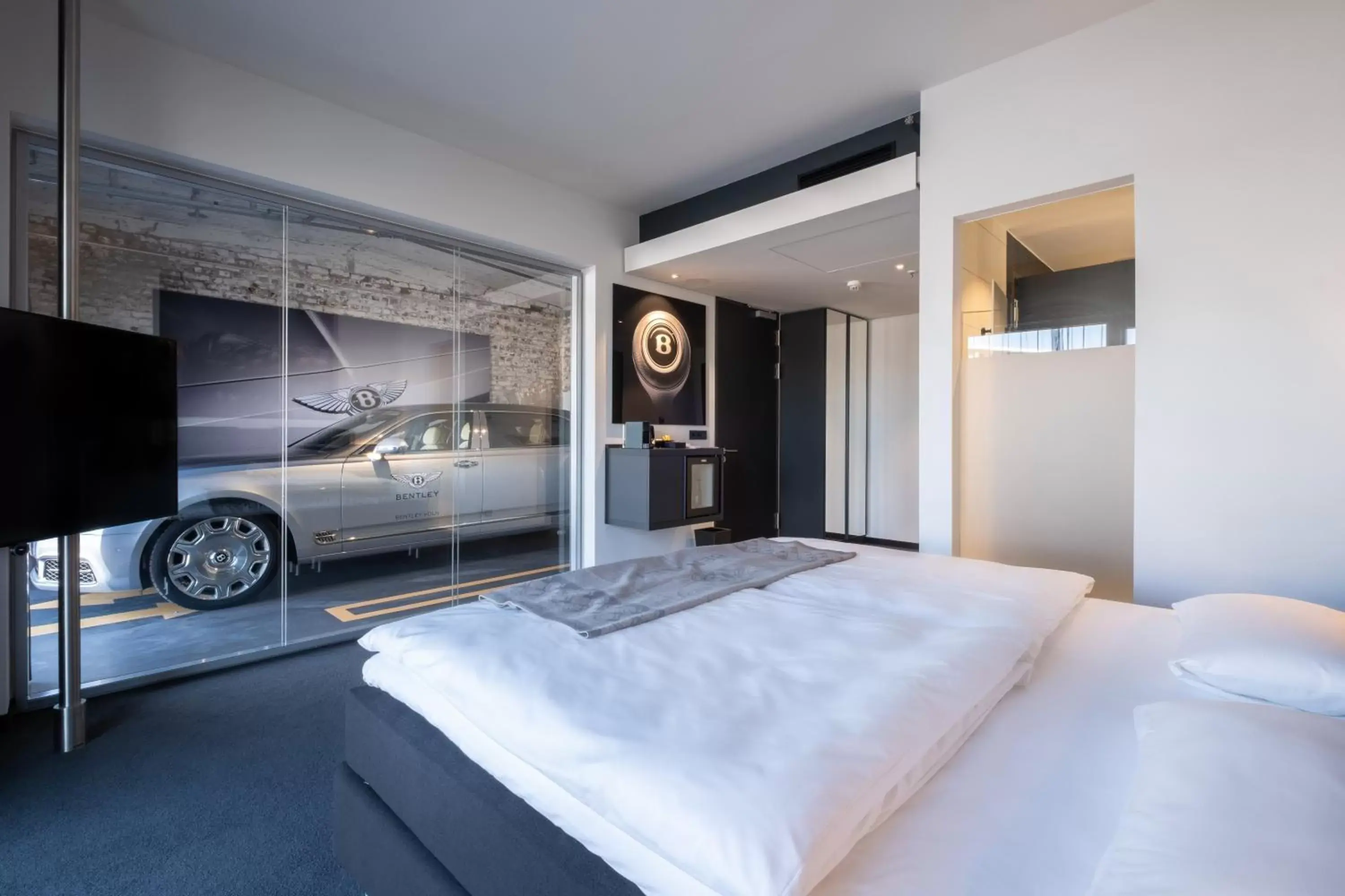 Photo of the whole room, Bed in V8 Hotel Köln at MOTORWORLD