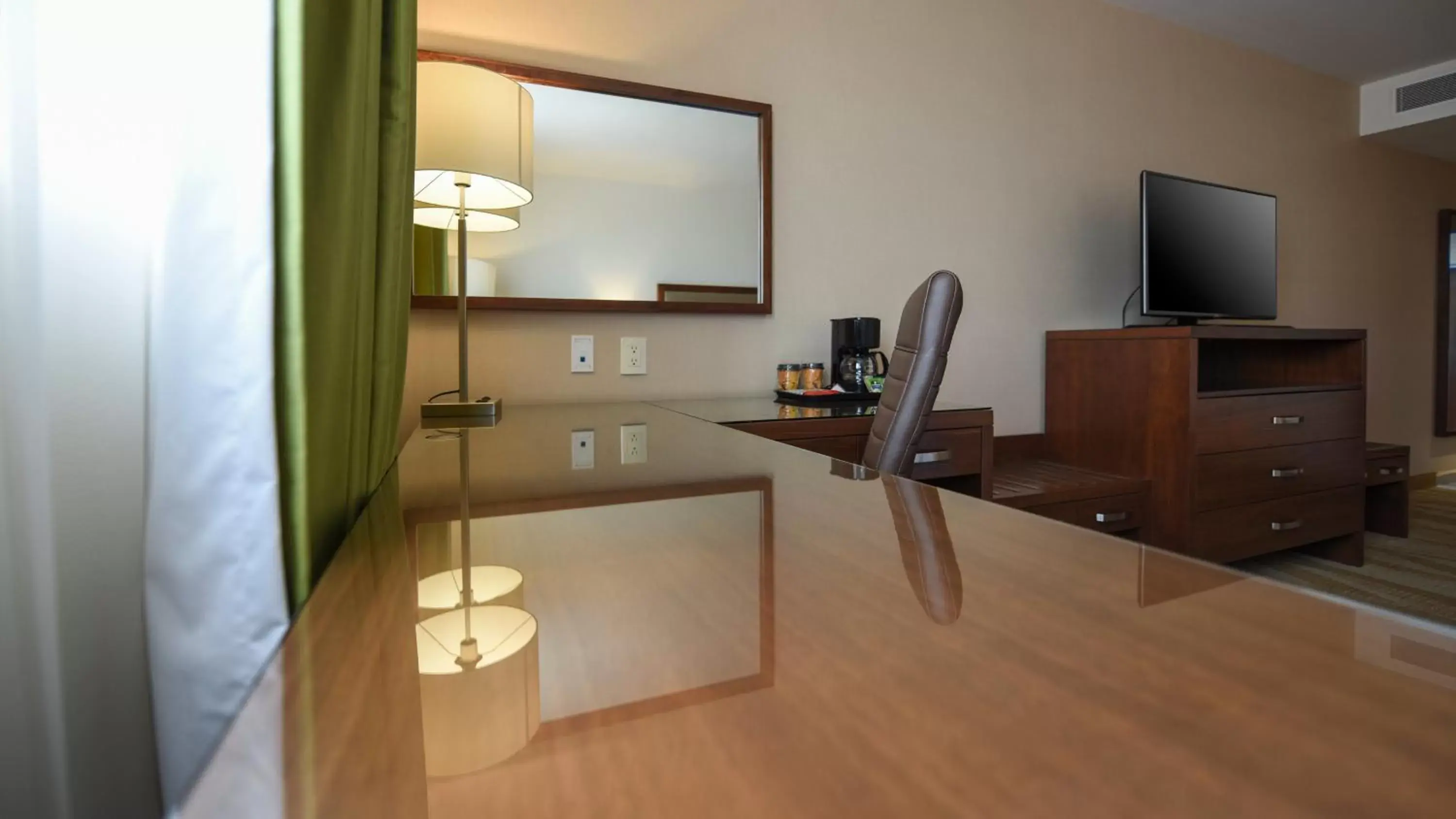 Photo of the whole room, TV/Entertainment Center in Holiday Inn Express and Suites Celaya, an IHG Hotel