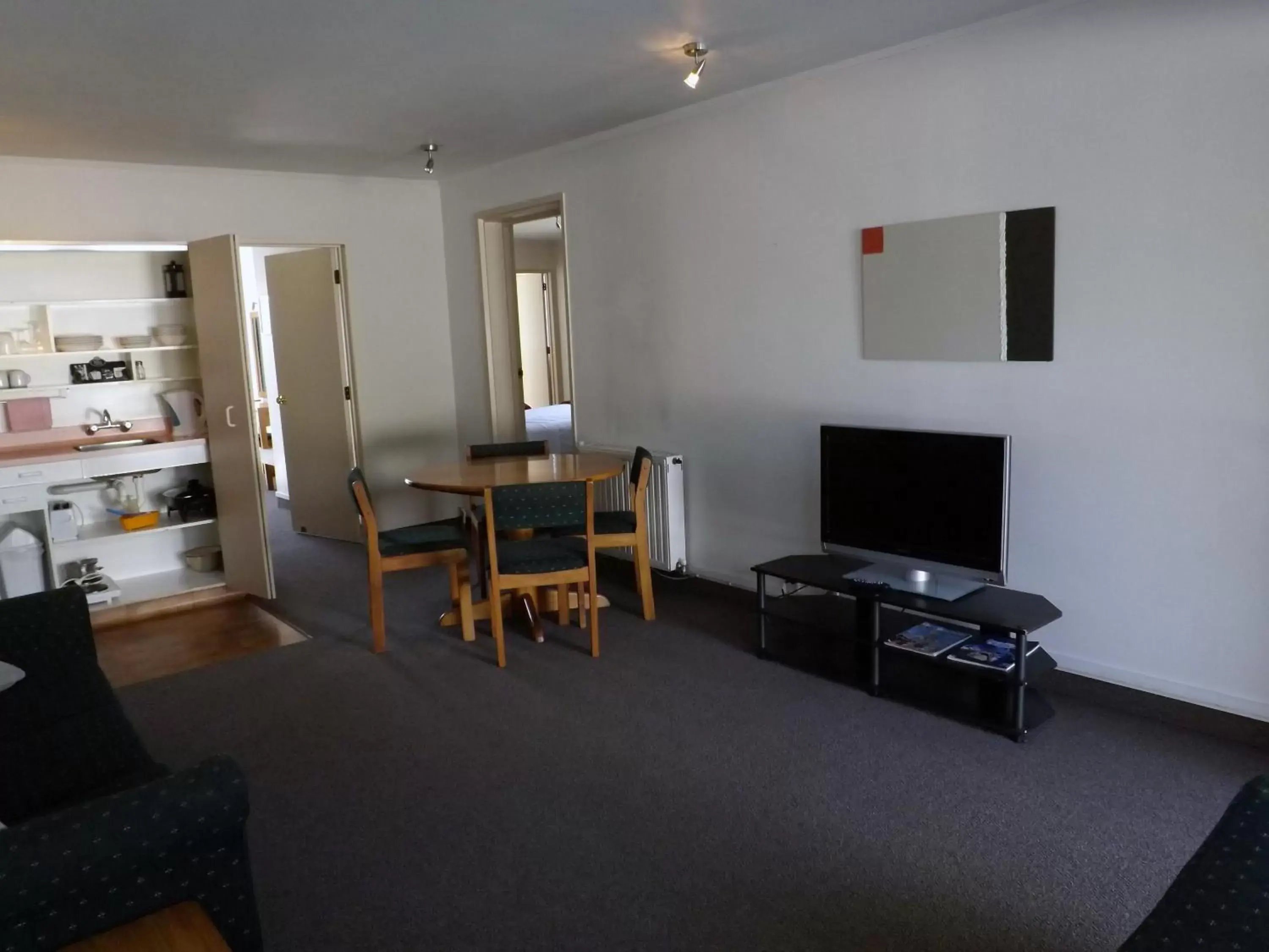 Photo of the whole room, TV/Entertainment Center in Karaka Tree Motel