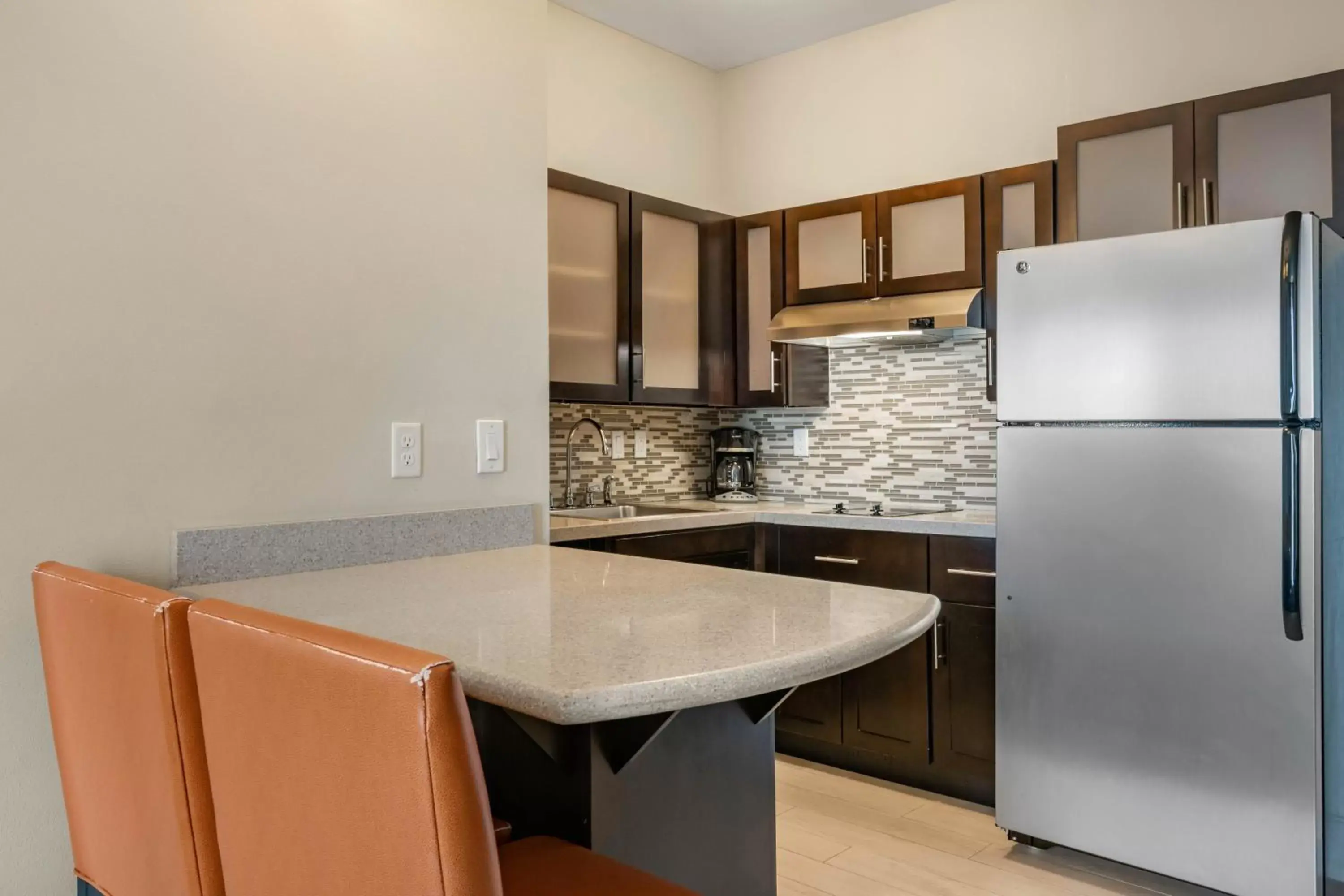 Photo of the whole room, Kitchen/Kitchenette in Staybridge Suites St. Petersburg FL, an IHG Hotel